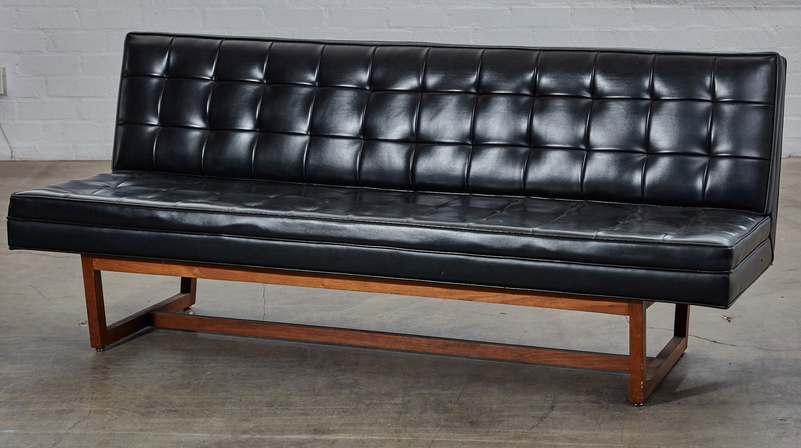 A hardwood framed faux black leather settee (1 of 4)