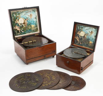Two Polyphon disk walnut music boxes: Two Polyphon disk walnut music boxeslate 19th centuryOne with 8in disks, the other with 6 1/2in disks. (12)the larger height 6in (15cm); width 10in (25.5cm); depth 9 1/2in (24cm)