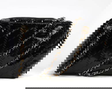 A Chanel black patent leather shoulder bag: A Chanel black patent leather shoulder bagcirca 1984-86height 6 1/2in (16.5cm); length 9in (22.8 cm); width 4in (10.1cm); shoulder strap drop 16in (40.6cm); CC medallion diameter 1 1/4in (4.4cm)