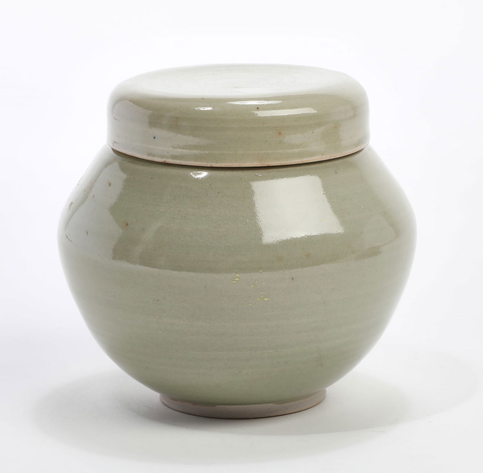 A covered green ceramic vessel (1 of 4)