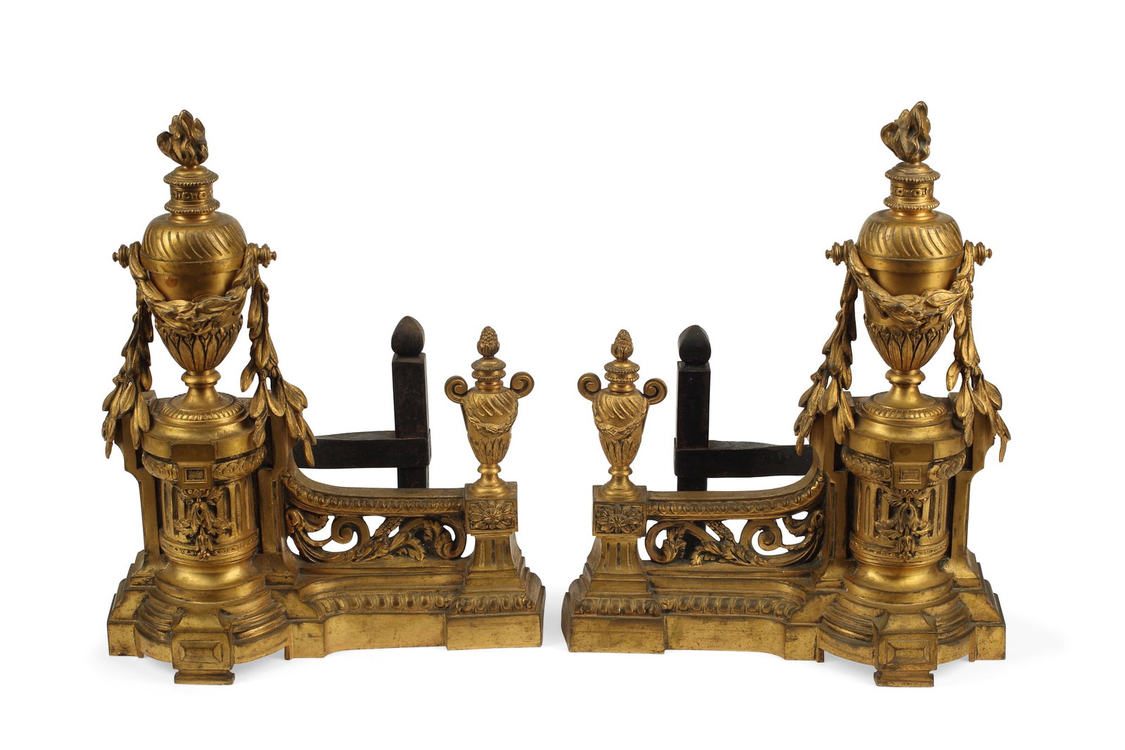 A pair of Louis XVI style bronze & iron chenets: A pair of Louis XVI style gilt bronze and iron chenets circa 1900 height 13in (33cm); width 10 1/2in (26.5cm); depth 7 1/2in (19cm)