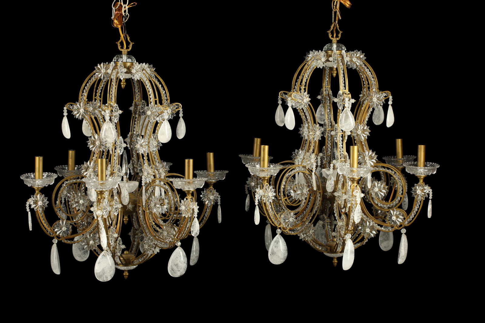 Pair of Rococo style glass and quartz chandeliers: A pair of Rococo style gilt metal beaded and cut glass and quartz six light chandeliers modern height 33in (84cm); diameter 27in (69cm)