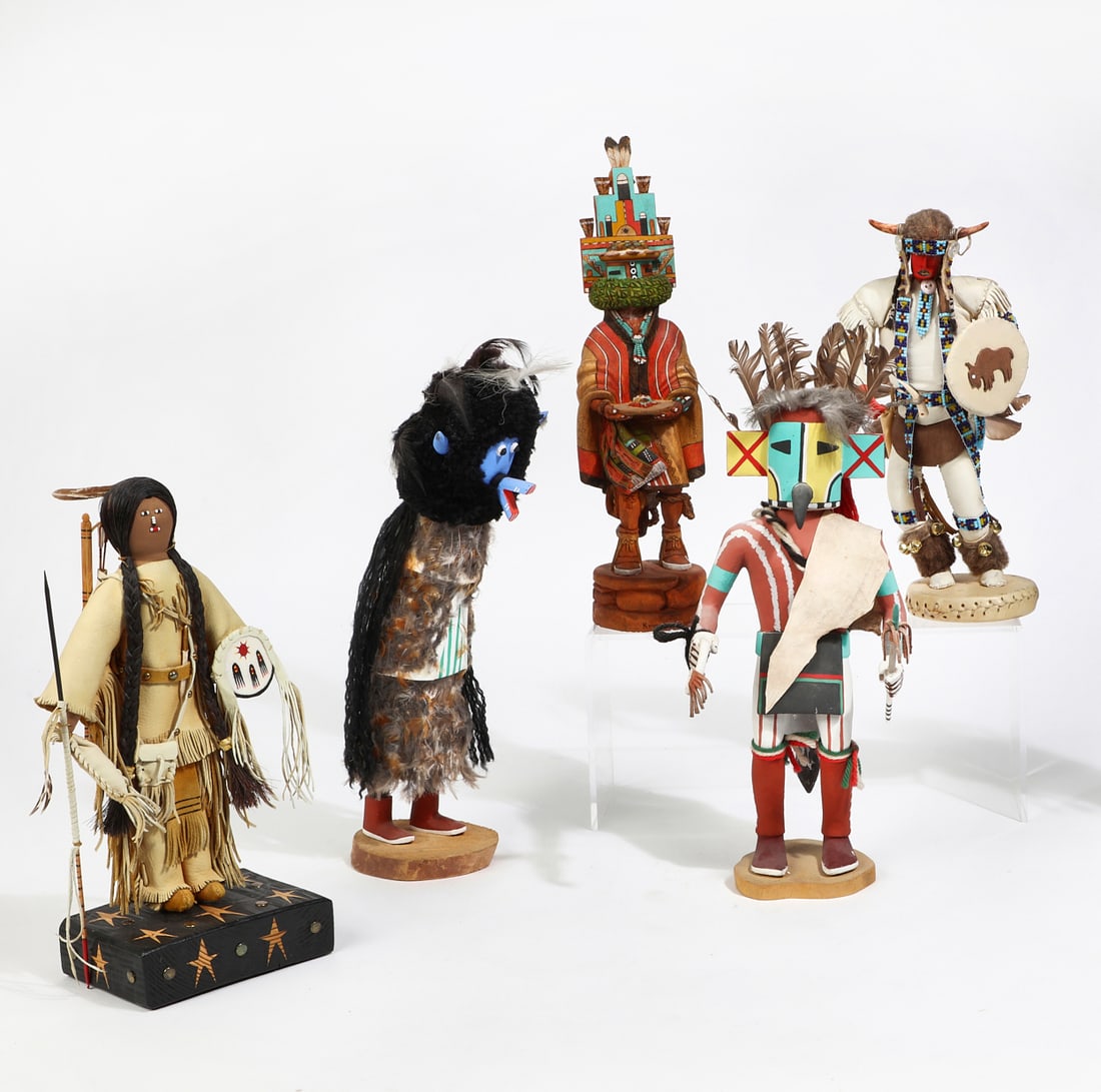 Five Native American decorated wood katchinas: A group of five Native American polychrome decorated wood katchinasvarious makersmodernFour variously signed.the largest height 14 1/2in (37cm); width 5in (12.5cm); depth 4 1/2in (11.5cm) Provenance: