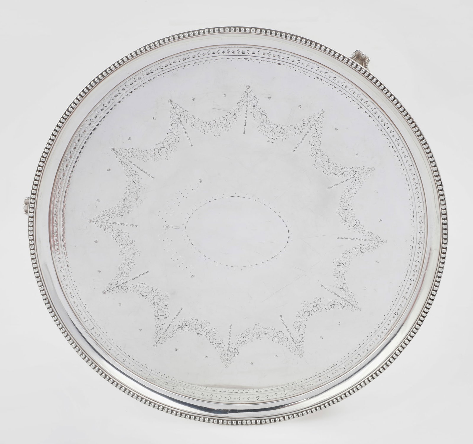 A George III sterling silver footed salver: A George III sterling silver footed salver maker's mark rubbed, London 1786 height 1 1/4in (3cm); diiameter 13 1/2in (34cm); weight approximately 34oz troy Provenance: The Edmund W. and Carol Browning