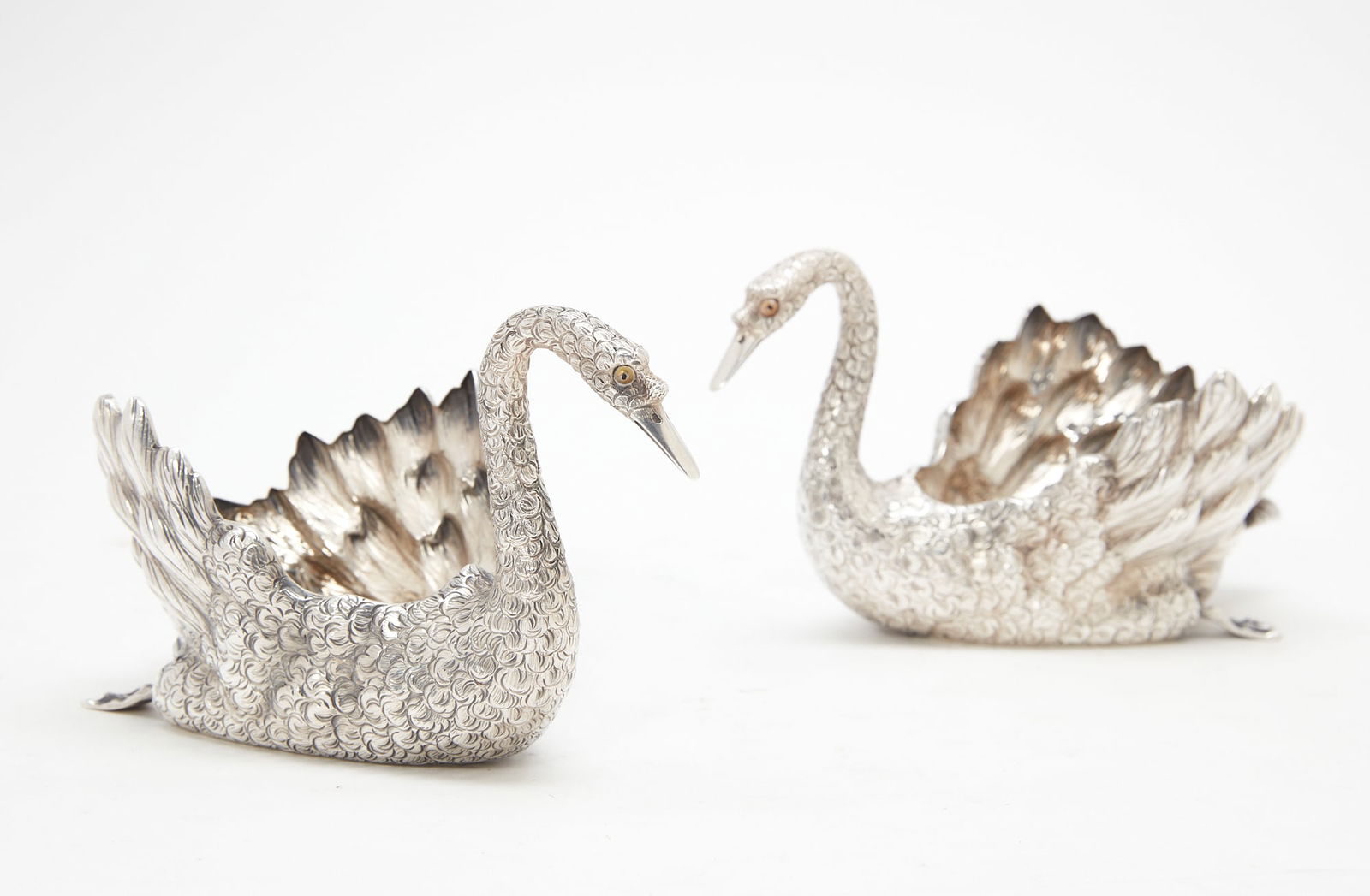 A pair of Italian sterling silver swan bowls: A pair of small Italian sterling silver swan form bowlsPradella Ilario for Buccellati, Milansecond half 20th centuryheight 4in (10cm); length 7 1/4in (18.5cm); width 4in (10cm); total weight approxima
