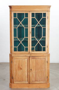 A George III pine corner cabinet: A George III pine corner cabinet18th/19th centuryheight 79 3/4in (202.5cm); width 40in (101.5cm); depth 21 1/4in (54cm) Provenance:Property from the Estate of Walter Nelson, ASID, San Diego, Californi