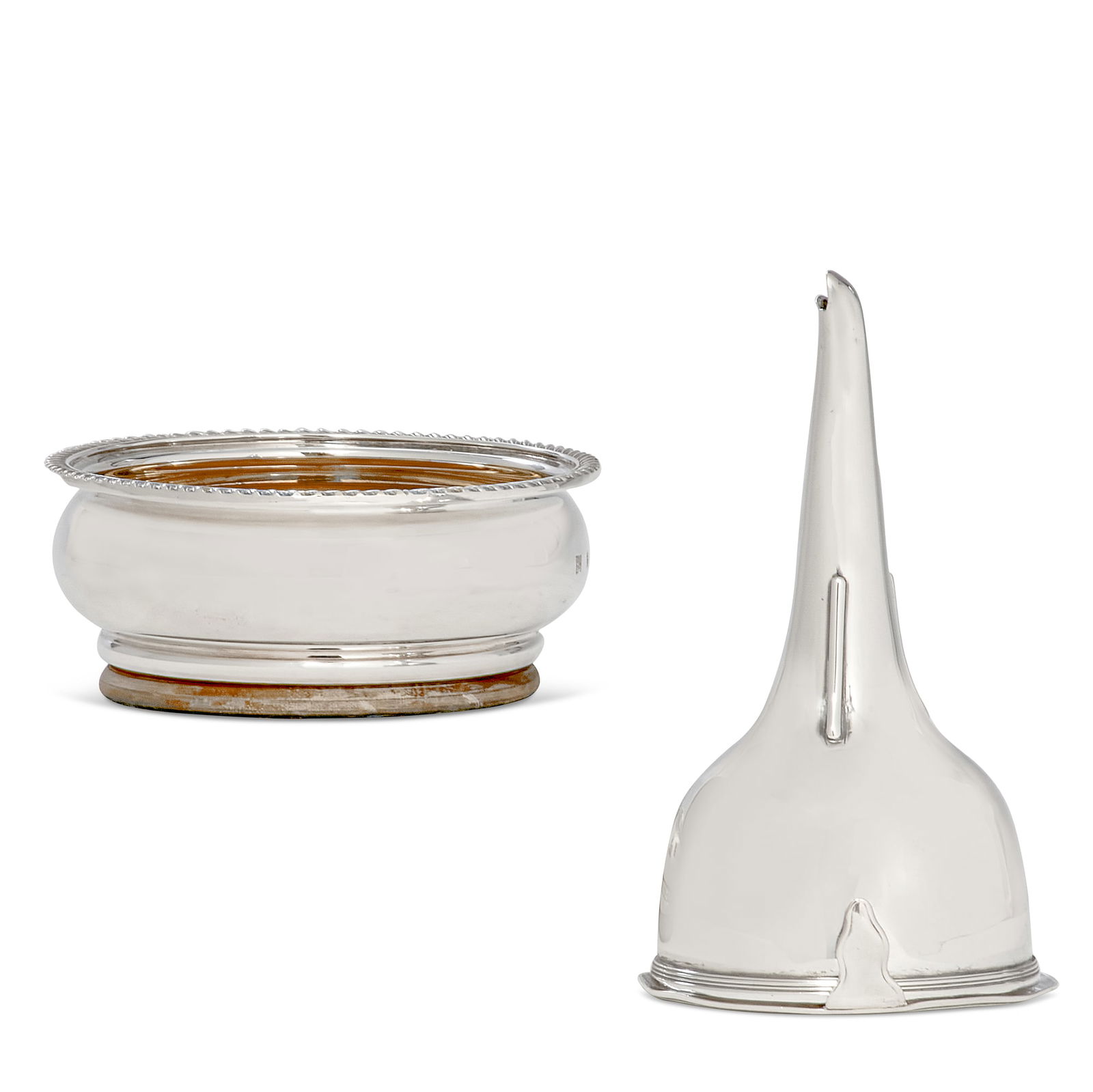A George III funnel and an Elizabeth II coaster: A George III sterling silver wine funnel and an Elizabeth II sterling silver bottle coastervarious makersearly 19th-late 20th centuryThe funnel Rebecca Emes & Edward Barnard I, London, 1808; the coast