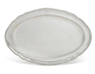 A large George III sterling silver oval meat dish: A large George III sterling silver oval meat dish Andrew Fogelberg & Stephen Gilbert, London 1791 With coat of arms and motto. length 21 1/2in (54.5cm); width 14 1/2in (37cm); weight approximately