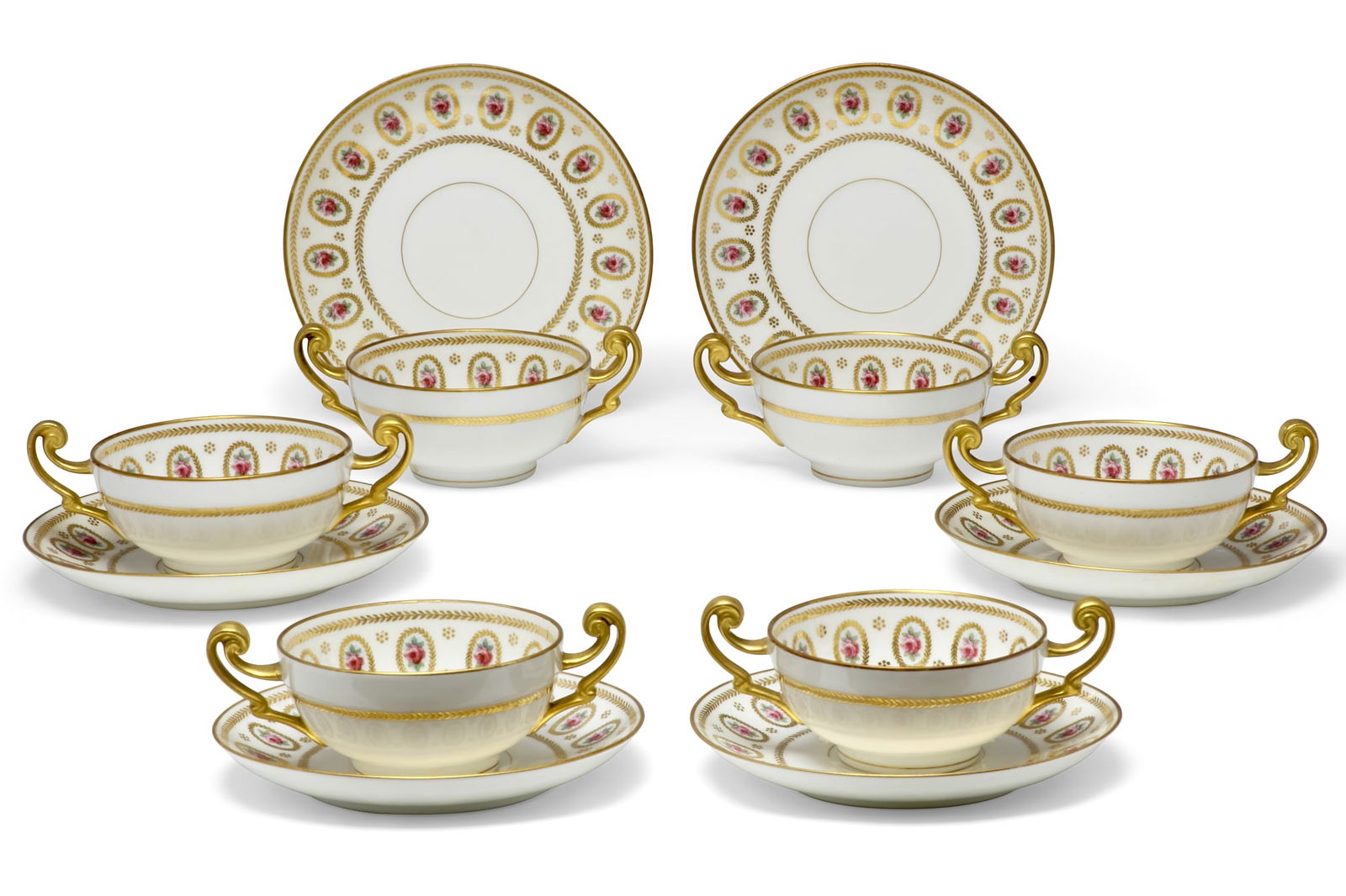Six Limoges porcelain cream soup cups and saucers: A set of six Limoges (Deliniere & Co./L. Bernardaud & Cie.) porcelain cream soup cups and saucersretailed by Higgins & Seiter, New Yorkcirca 1905Decorated with vignettes of roses within gilt borders,