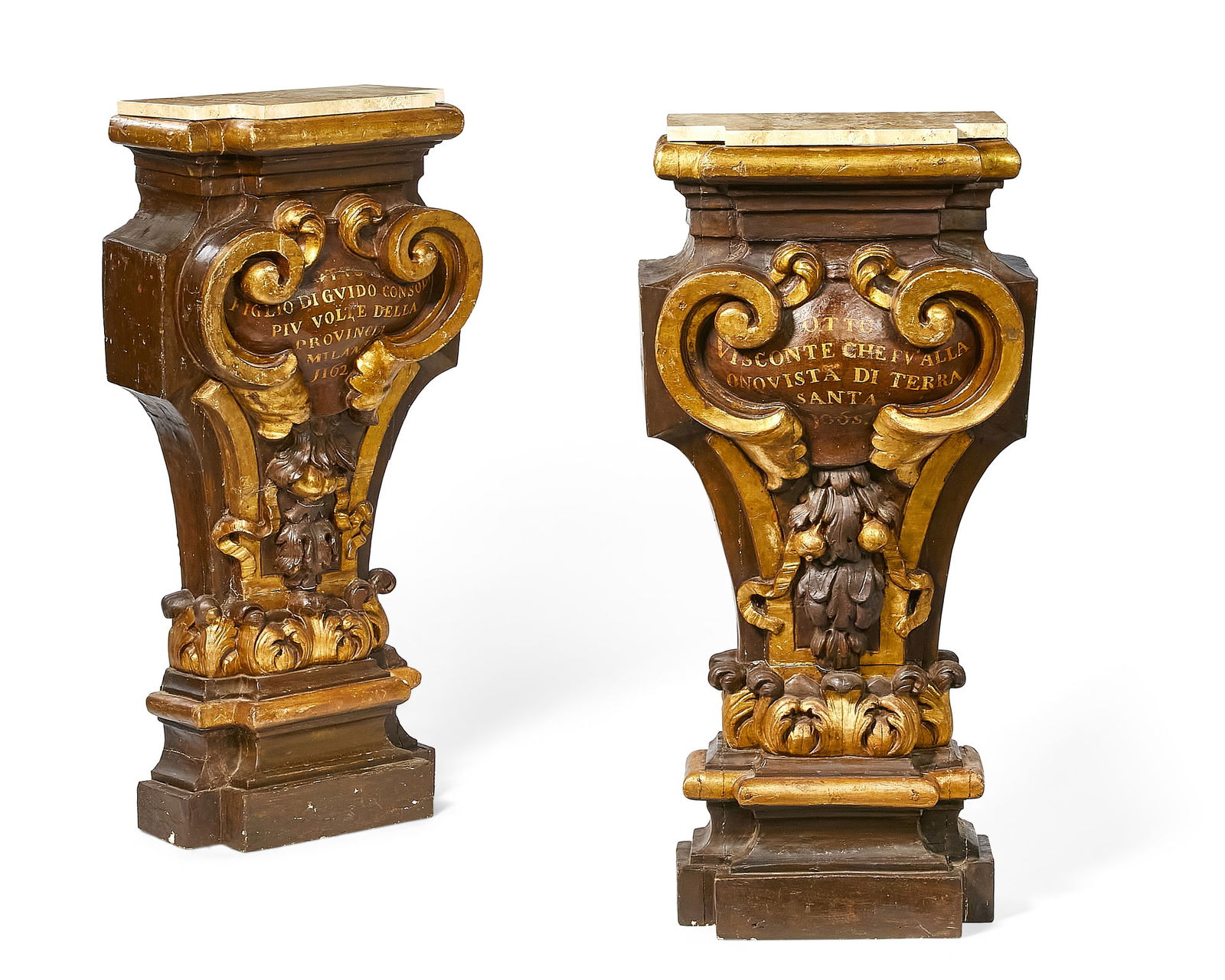 A pair of Italian Baroque painted half pedestals: A pair of Italian Baroque parcel gilt brown painted half pedestalslate 17th/early 18th centuryEach variously inscribed OTTO / VISCONTE CHE FV ALLA / ONOVISTA DI TERRA / SANTA / 1065 and OTTO / FIGLIO