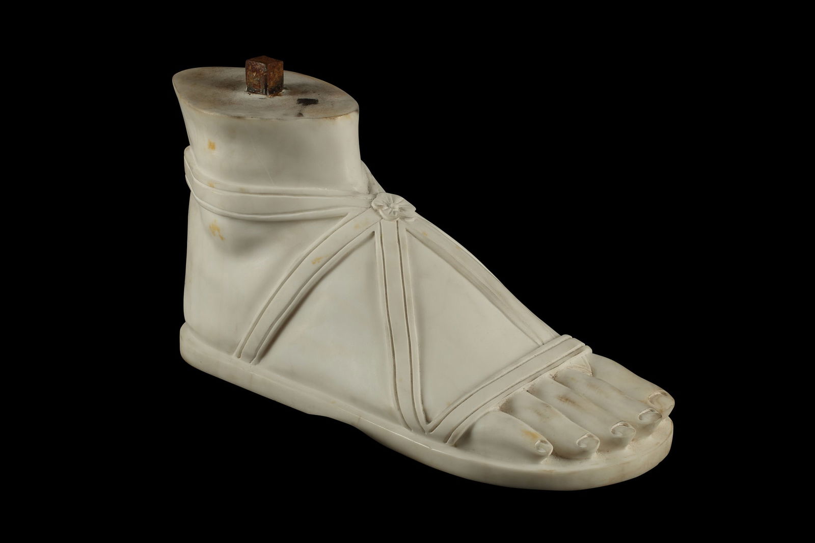 A carved marble model of a sandaled foot (1 of 6)