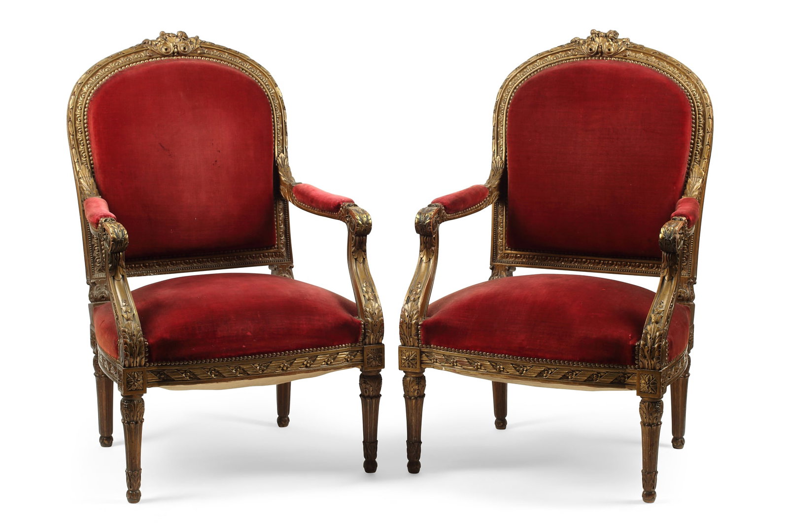 A pair of Louis XVI style giltwood armchairs: A pair of Louis XVI style carved giltwood armchairs circa 1900 height 43in (109cm); width 27 1/2in (70cm); depth of seat 21in (53cm)