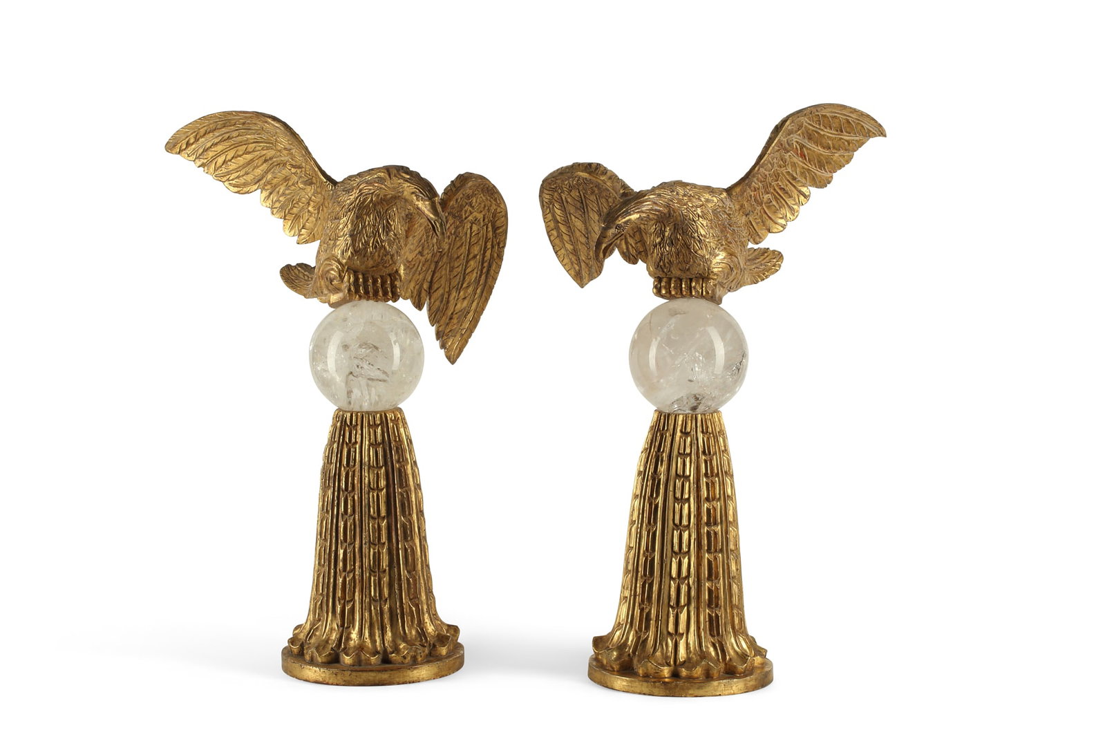 A pair of Baroque style models of eagles: A pair of Baroque style carved giltwood and rock crystal models of eagles post 1950 height 26in (66cm); width 15in (38cm); depth 16in (41cm)