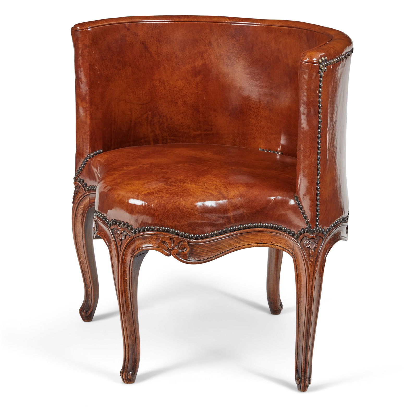 A Louis XV style beechwood bergere de bureau: A Louis XV style beechwood bergere de bureau post 1950 height 28in (71cm); width 26 1/4in (67cm): depth of seat 20 1/2in (52cm)