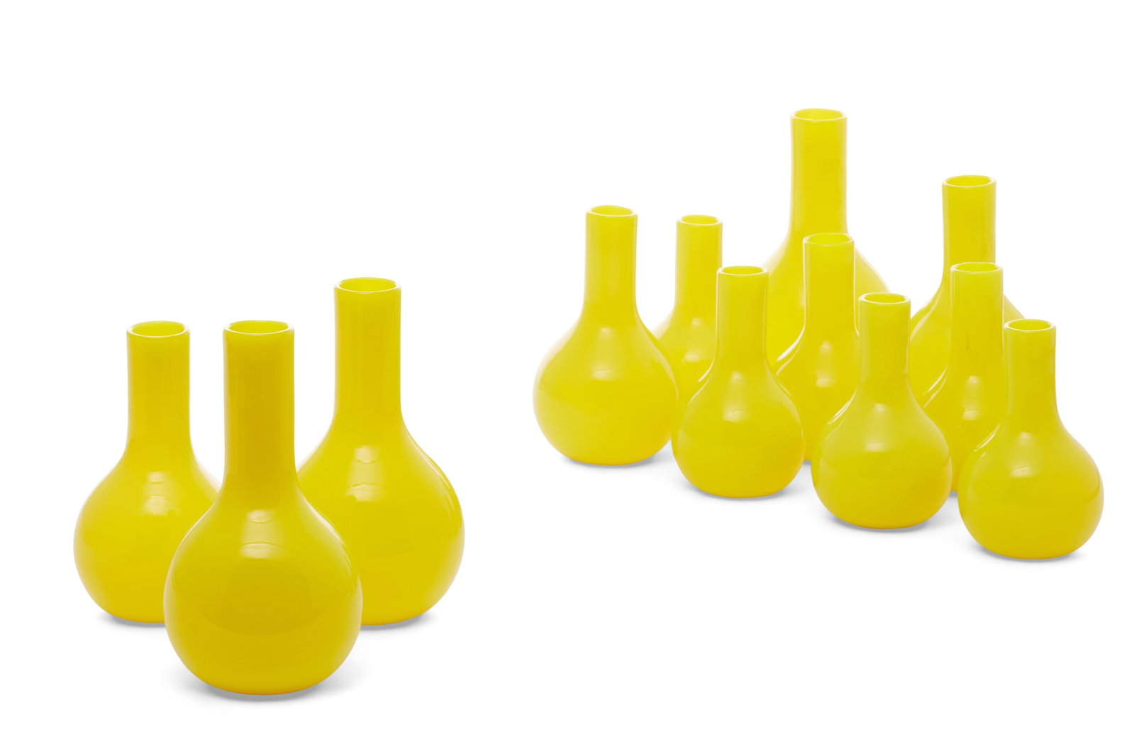 Twelve Venetian yellow bottle vases, 20th century: Twelve Venetian yellow bottle vases 20th century Comprising six 4 1/4in vases; three 5in vases and three 5 7/8in vases.