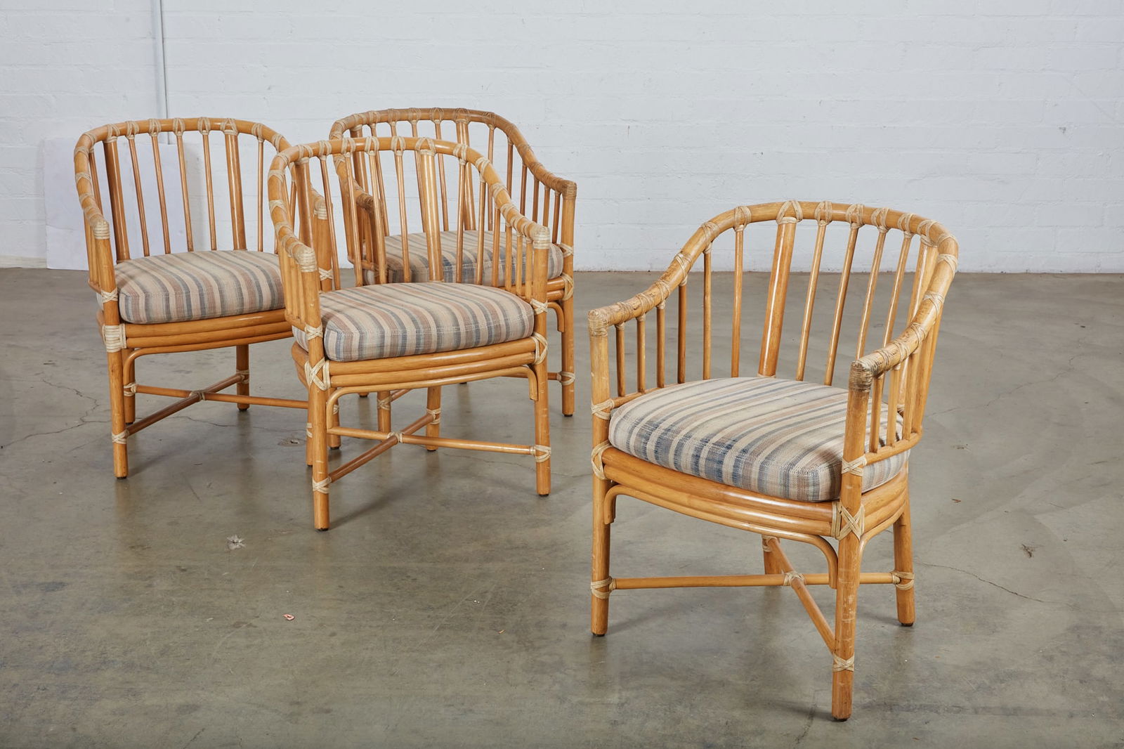 A set of four McGuire rattan patio armchairs (1 of 7)