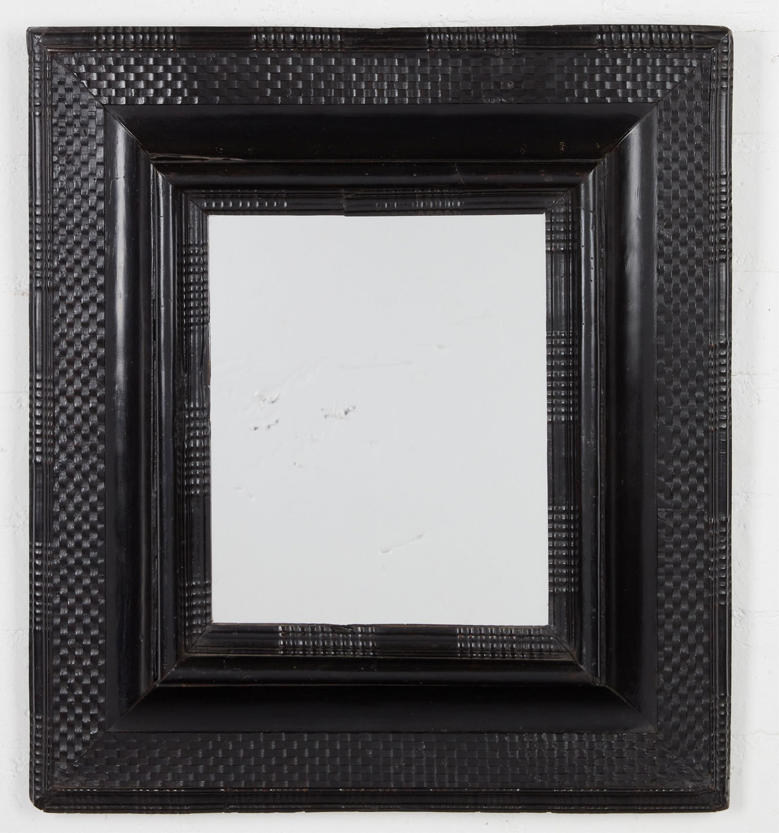 A Continental Baroque ebonized carved wood mirror (1 of 3)