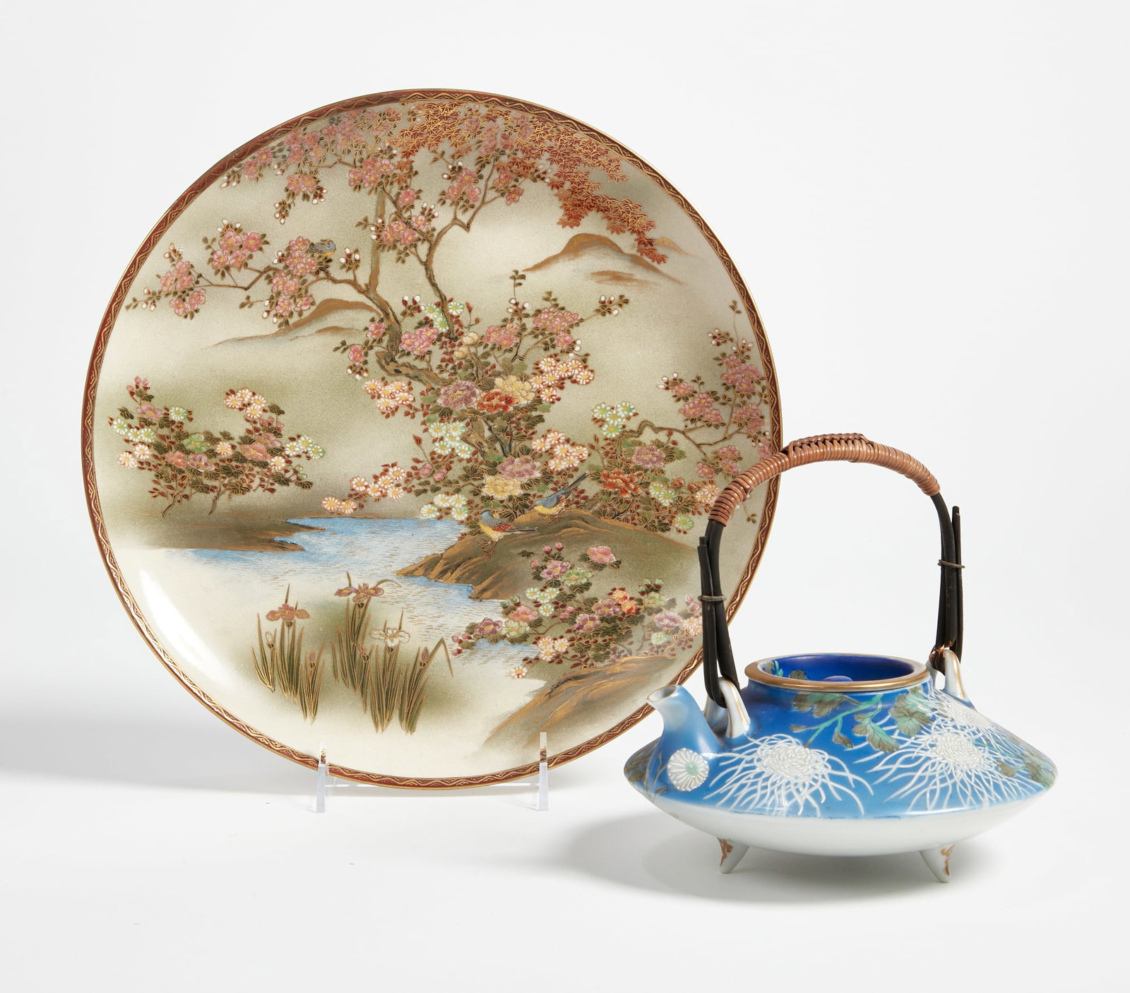 A Japanese satsuma plate and unassociated teapot: A Japanese satsuma plate and unassociated teapot The plate with red Koshida marks to underside. plate diameter 11 3/4in (30cm)