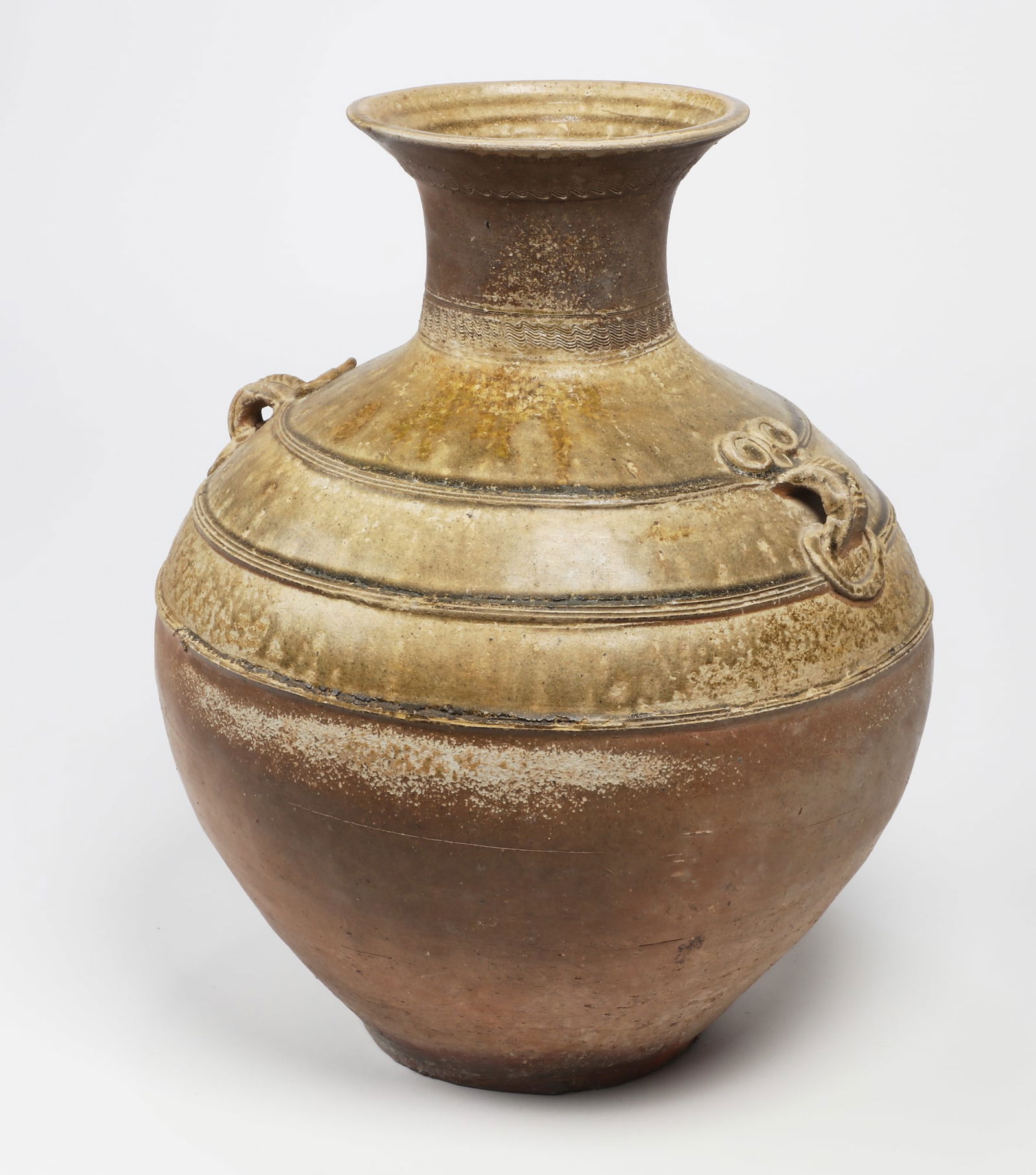 An Asian glazed earthenware vase (1 of 4)