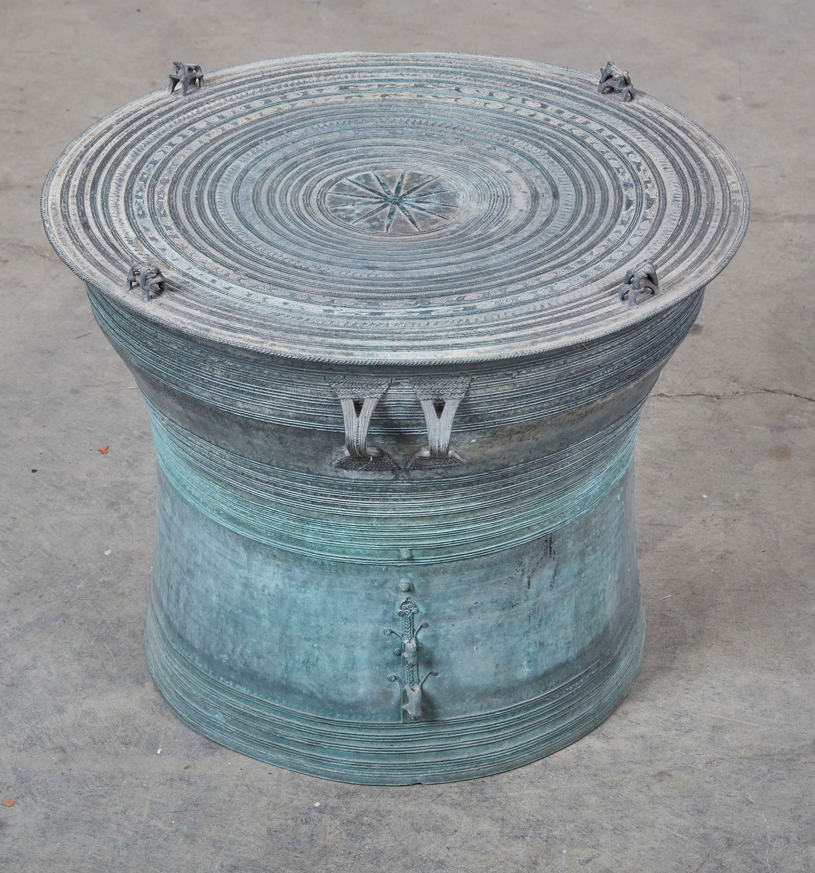 A Southeast Asian bronze rain drum: A Southeast Asian bronze rain drumheight 17 1/2in (44cm); diameter 21 1/4in (53cm)