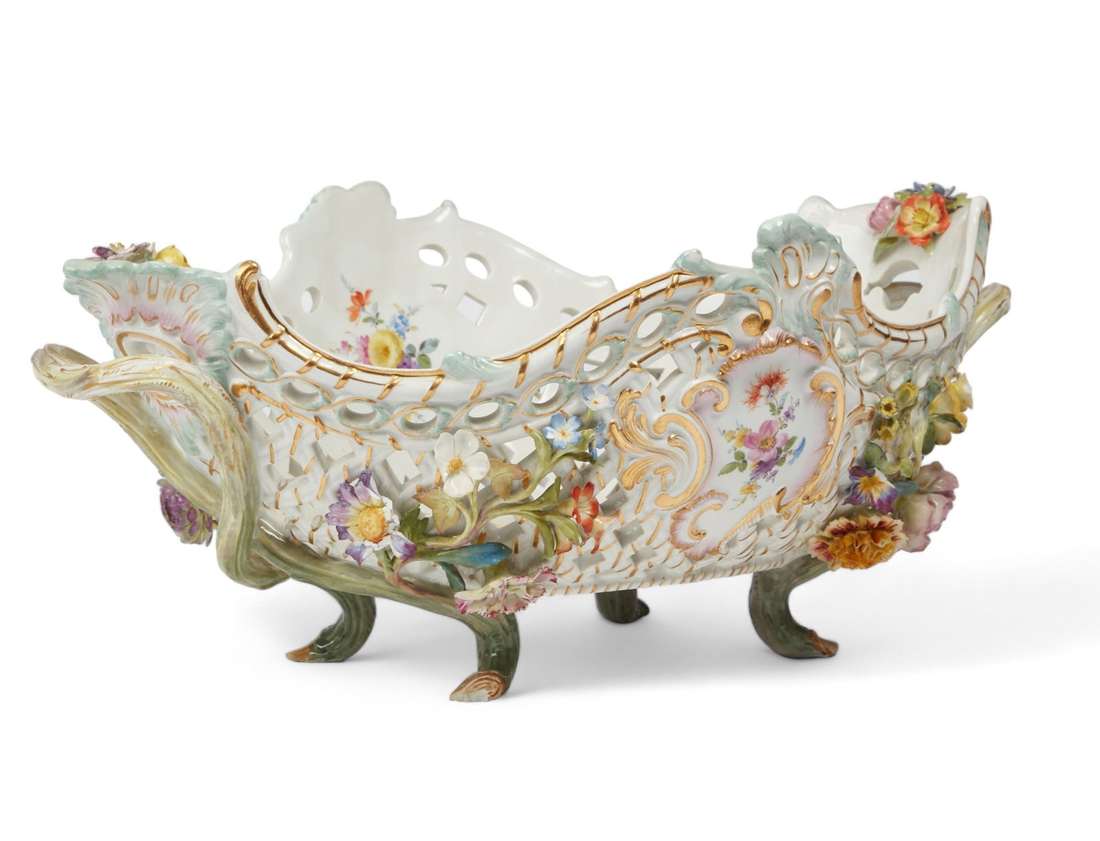 A Meissen porcelain centerpiece basket, late 19th century: A Meissen porcelain centerpiece basket late 19th century Underglaze blue crossed swords, incised model E150. height 6 1/2in (16.5cm); width across handles 17in (43cm); depth 11 1/2in (29cm)