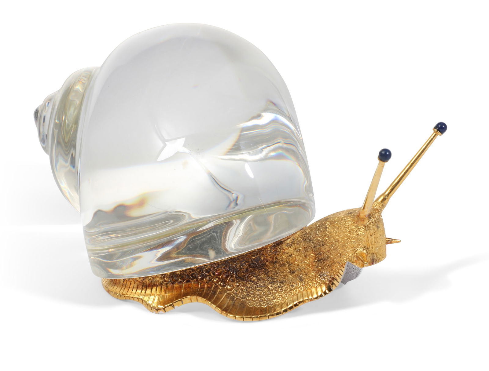 A Steuben silver gilt, glass and lapis lazuli model of a snail, designed by Paul Schulze, issued: A Steuben silver gilt, glass and lapis lazuli model of a snaildesigned by Paul Schulzeissued 1971Model 1025, etched Steuben, metalwork stamped STERLING STEUBEN, in original factory box.height 3 1/4in