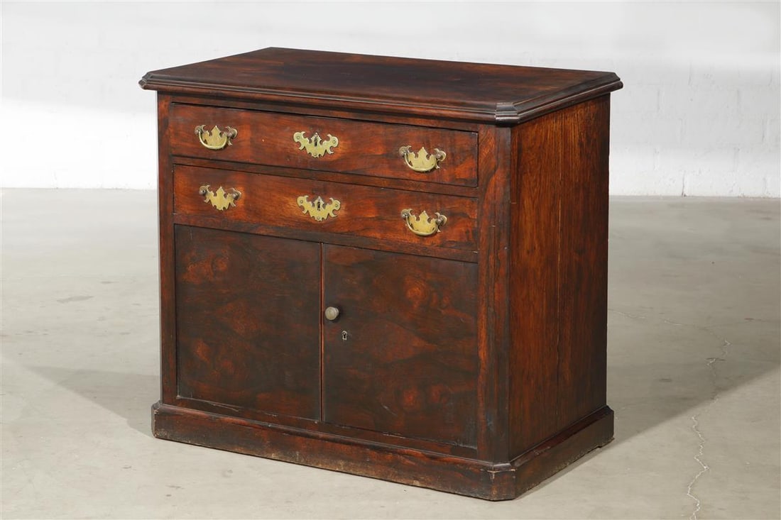 A George III exotic hardwood chest of drawers: A George III exotic hardwood chest of drawers late 18th/early 19th century height 31 1/2in (80cm); width 35 3/4in (91cm); depth 20 1/4in (51cm)
