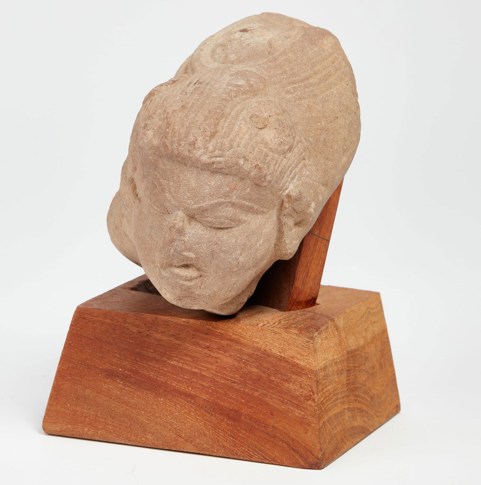 A South Asian  sandstone head of a deity (1 of 3)