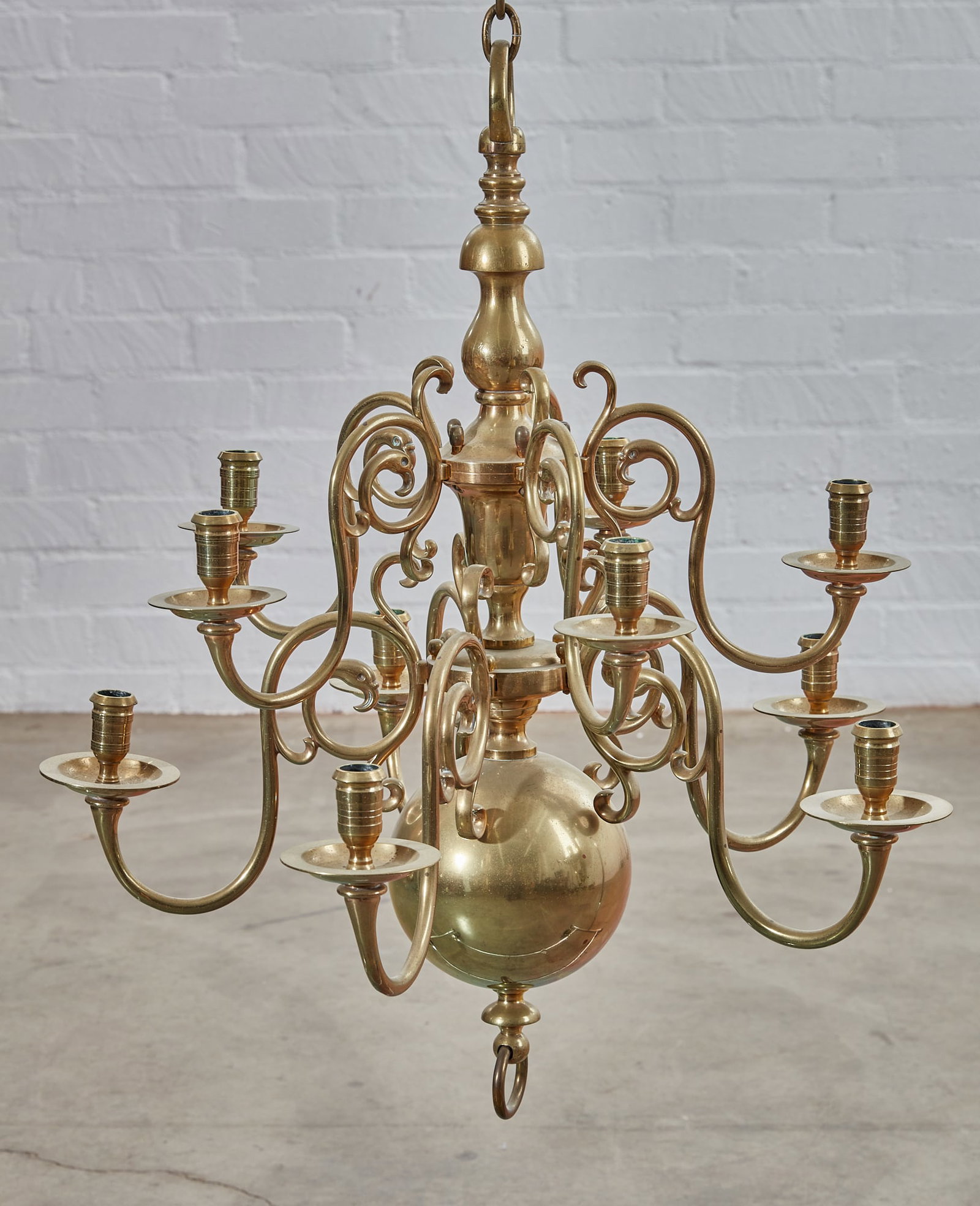 A Dutch Baroque style brass ten light chandelier: A Dutch Baroque style brass ten light chandelier 20th century height approximately 27in (69cm); diameter 24in (61cm)