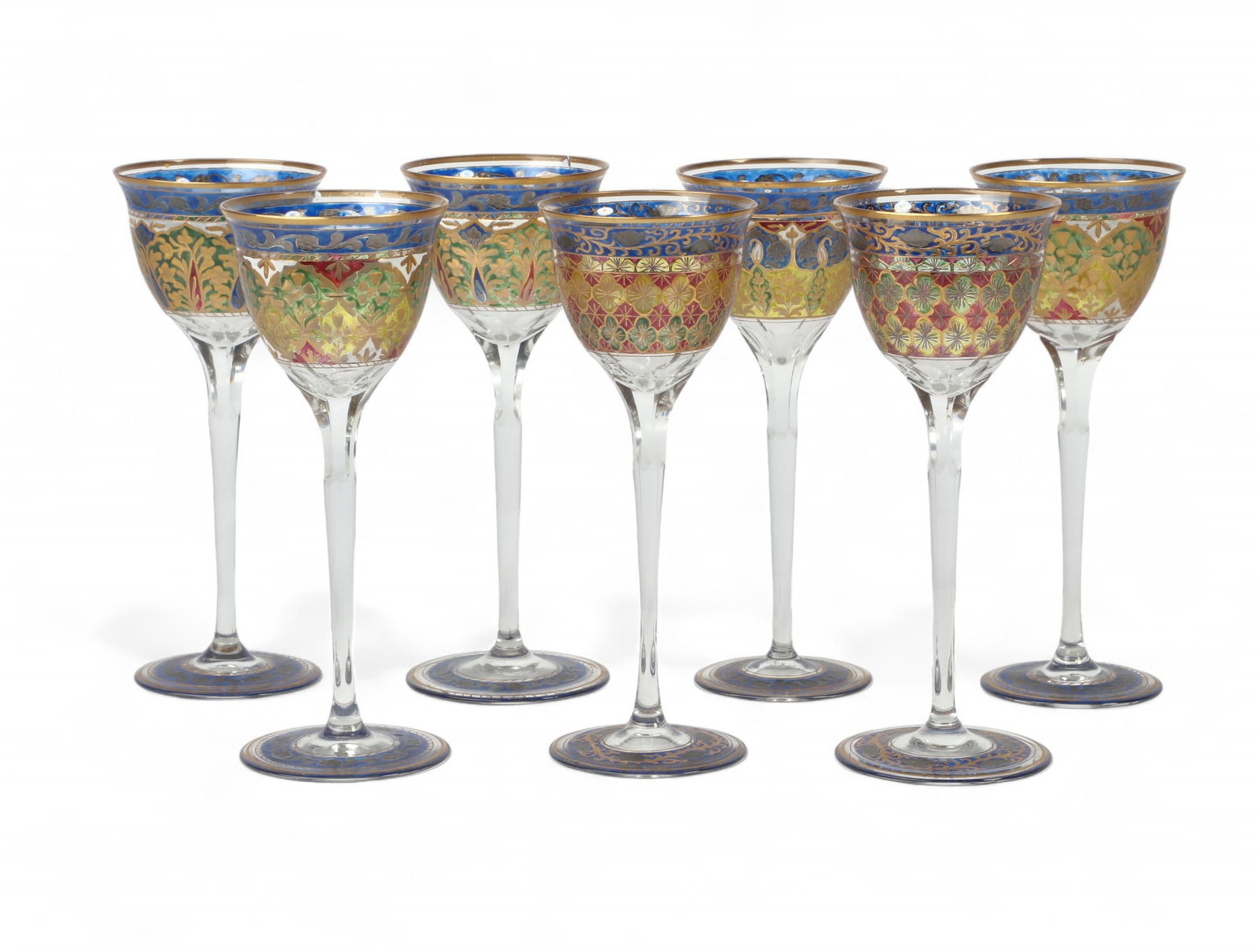 An assembled suite of Continental wine glasses: An assembled suite of seven Continental gilt heightened enamel decorated wine glasses late 19th/early 20th century height 8in (20.3cm)