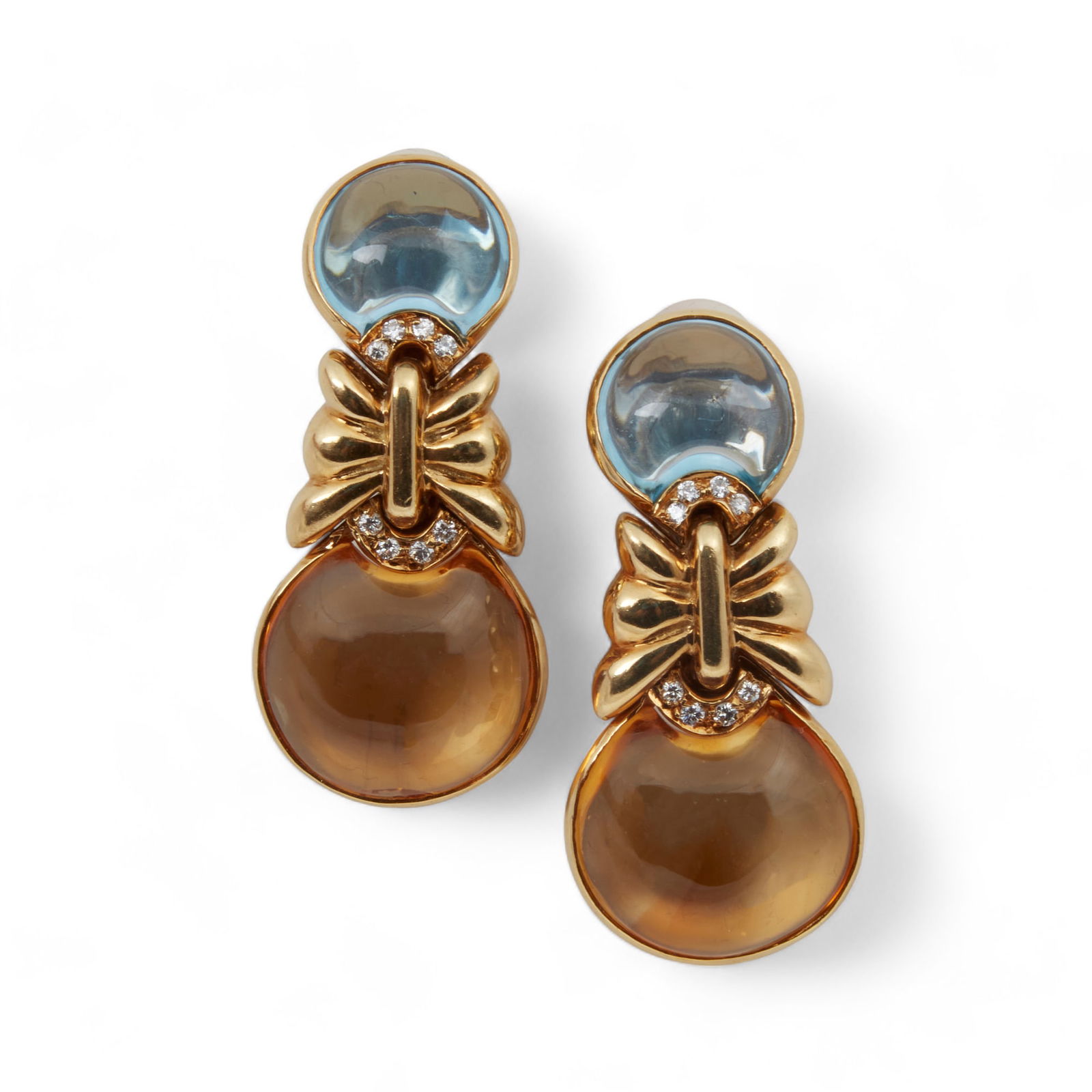 A pair of diamond and 18K yellow gold ear clips (1 of 3)