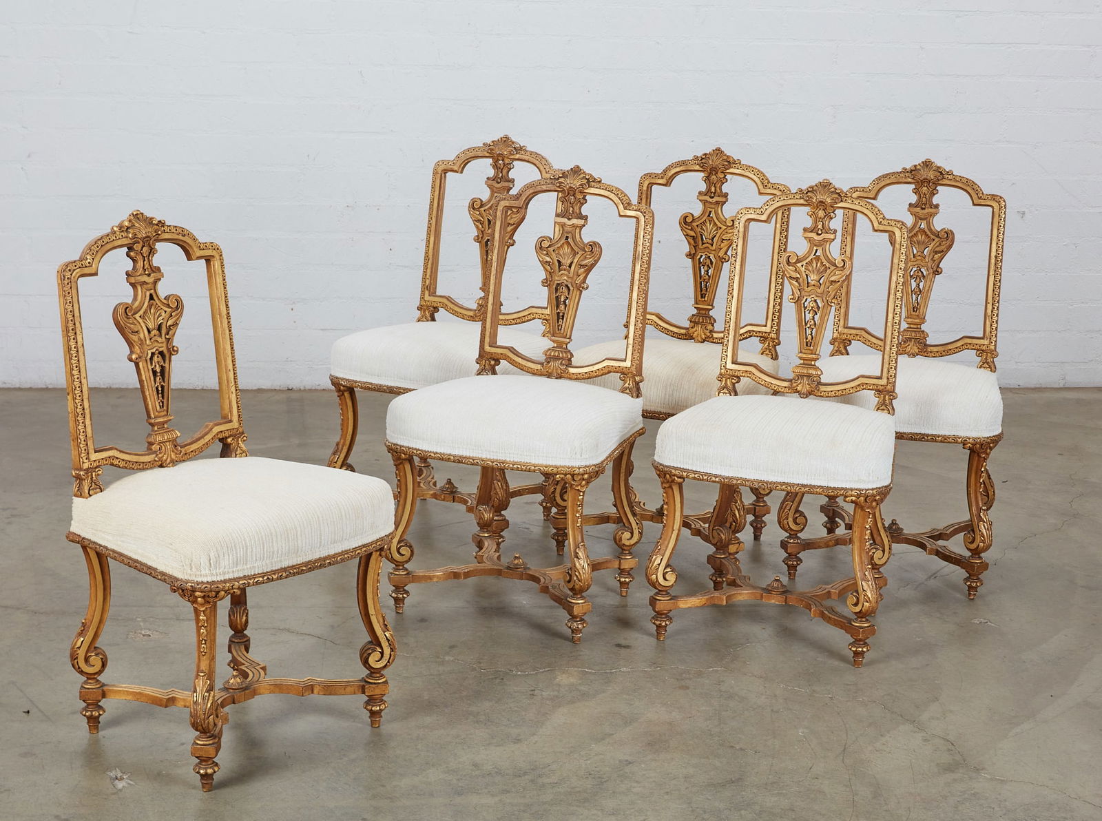A set of six Louis XIV style giltwood chaises: A set of six Louis XIV style giltwood chaiseslate 19th centuryheight 36 1/4in (92cm); width 18in (46cm); depth 15in (38cm)