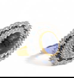 A sapphire, diamond and 18K bi-colored gold ring