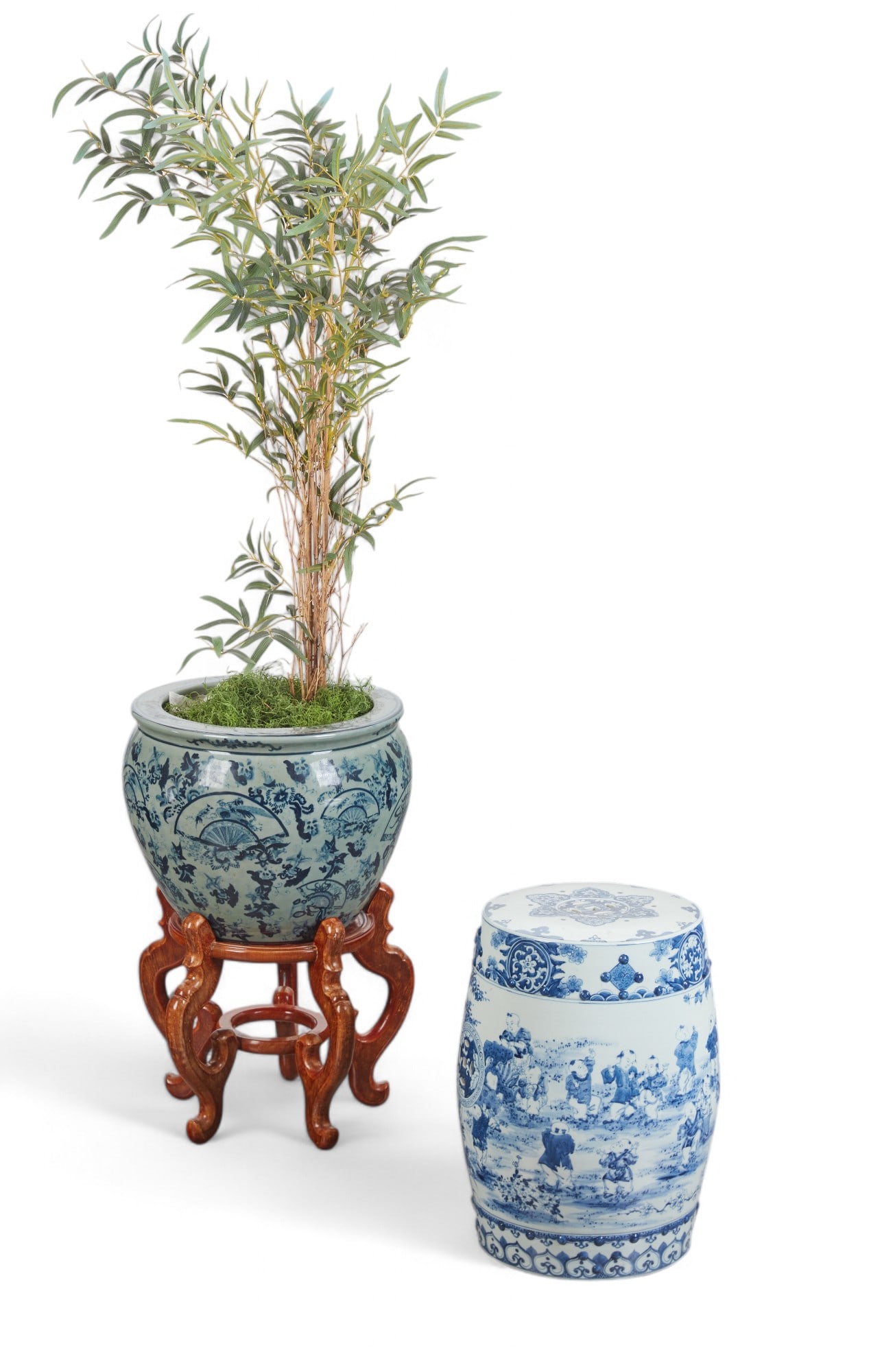 A Chinese porcelain jardiniere and garden seat: A Chinese blue and celadon porcelain jardiniere on stand and a blue and white porcelain garden seat(2)height of jardiniere 14in (35.5cm); height of seat 19in (48.5cm)