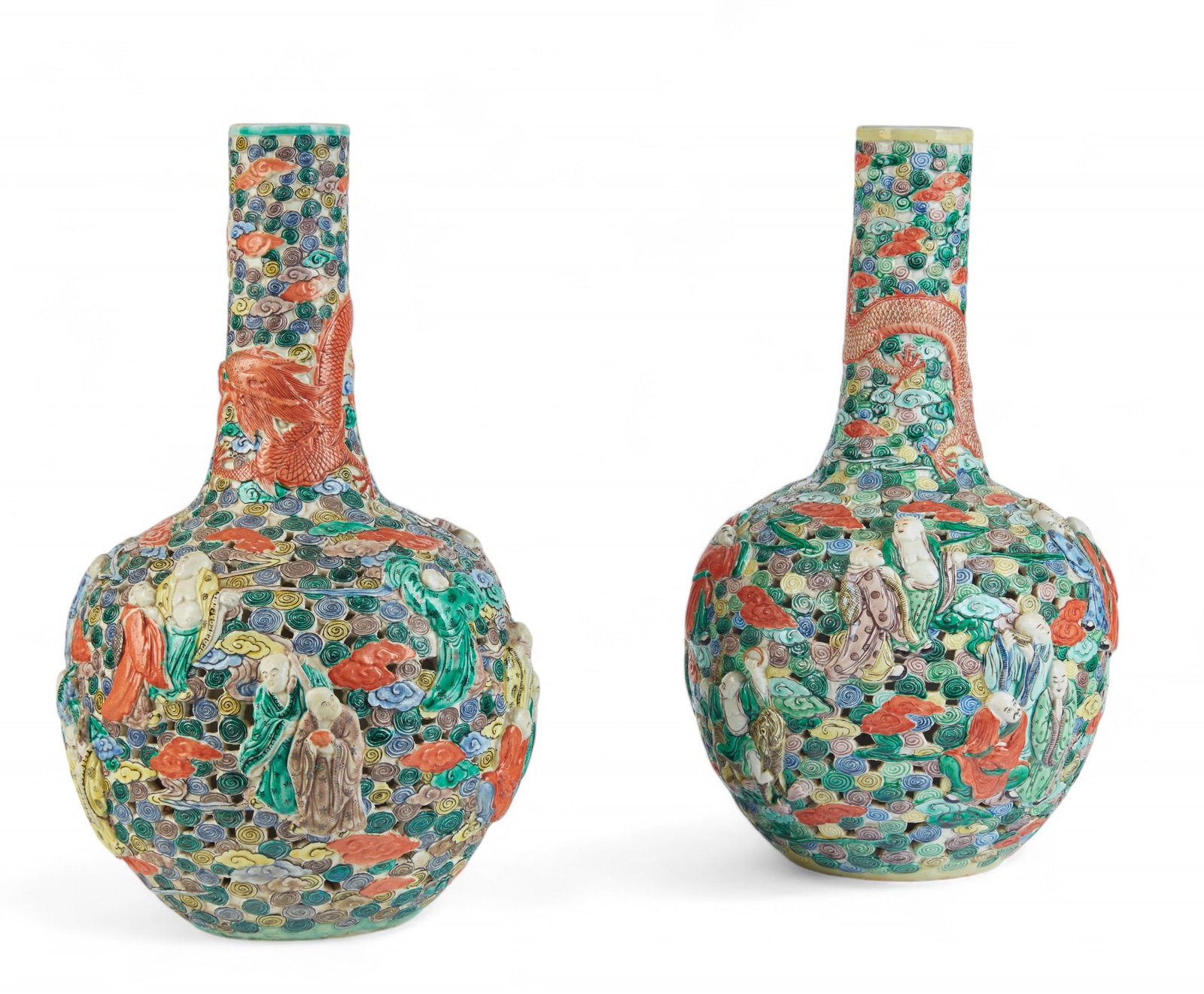 Two Chinese porcelain Eighteen Arhat vases: Two Chinese Famille Verte porcelain reticulated relief decorated Eighteen Arhat vases Each with relief seal mark to underside. height 17in (43cm); diameter 8 1/2in (21.5cm) Provenance: The estate of F