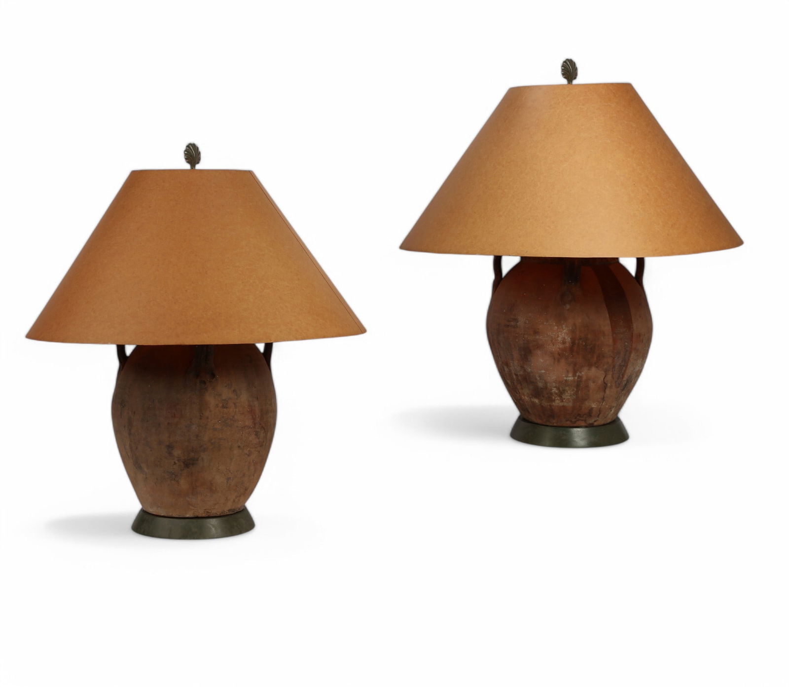 Two rustic pottery jars, possibly Michael Taylor: A near pair of rustic pottery jars now as lampspossibly Michael Taylorpost 1950height to finial 32in (80cm); diameter 13 1/2in (34cm) Provenance:Property from a Private Collection, Santa Monica, Cali
