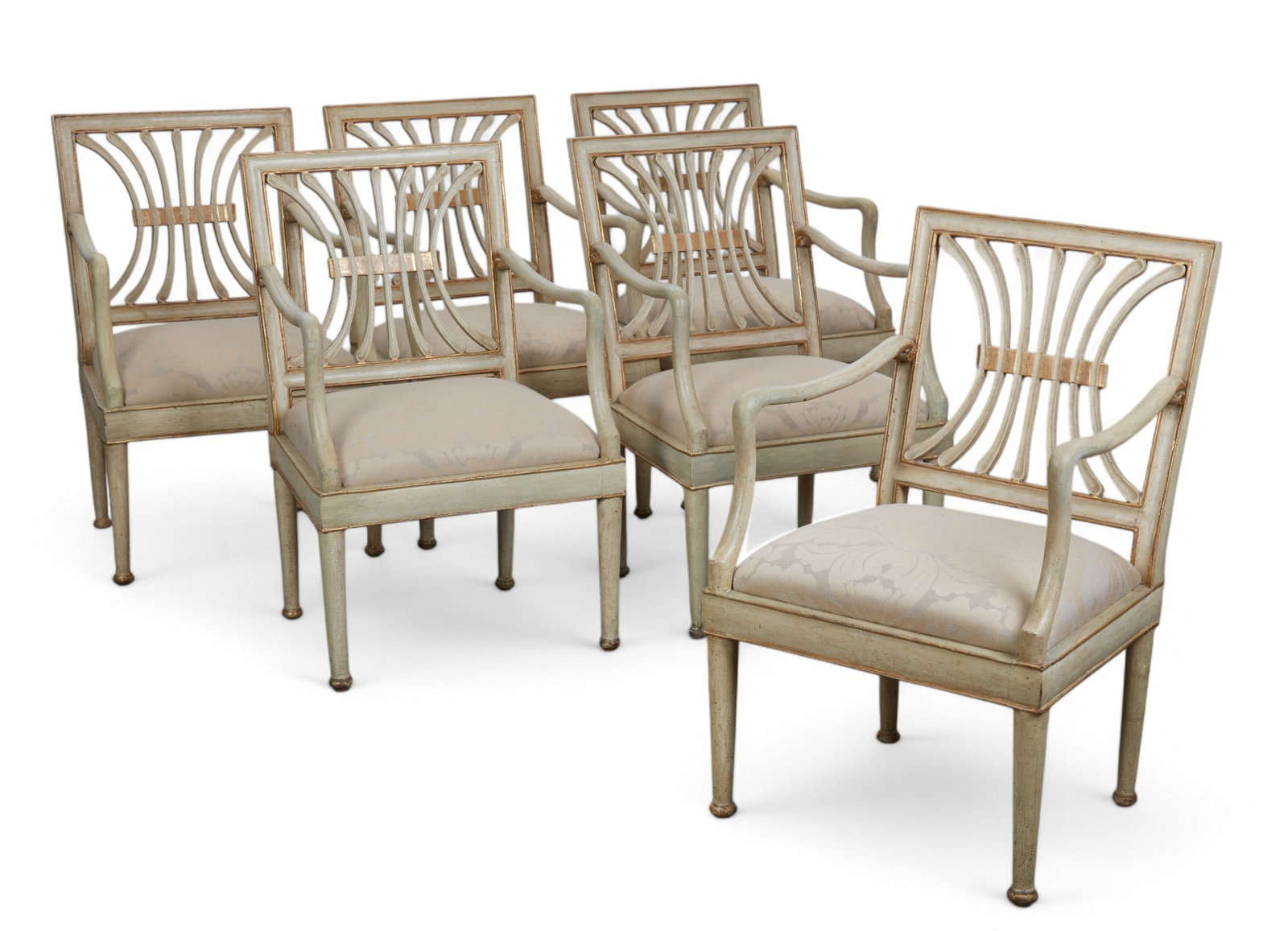 Six Italian Neoclassical style gilt armchairs: A set of six Italian Neoclassical style parcel gilt grey painted armchairs late 19th/early 20th century height 36in (92cm); width 23 1/2in (60cm); depth 18in (46cm)