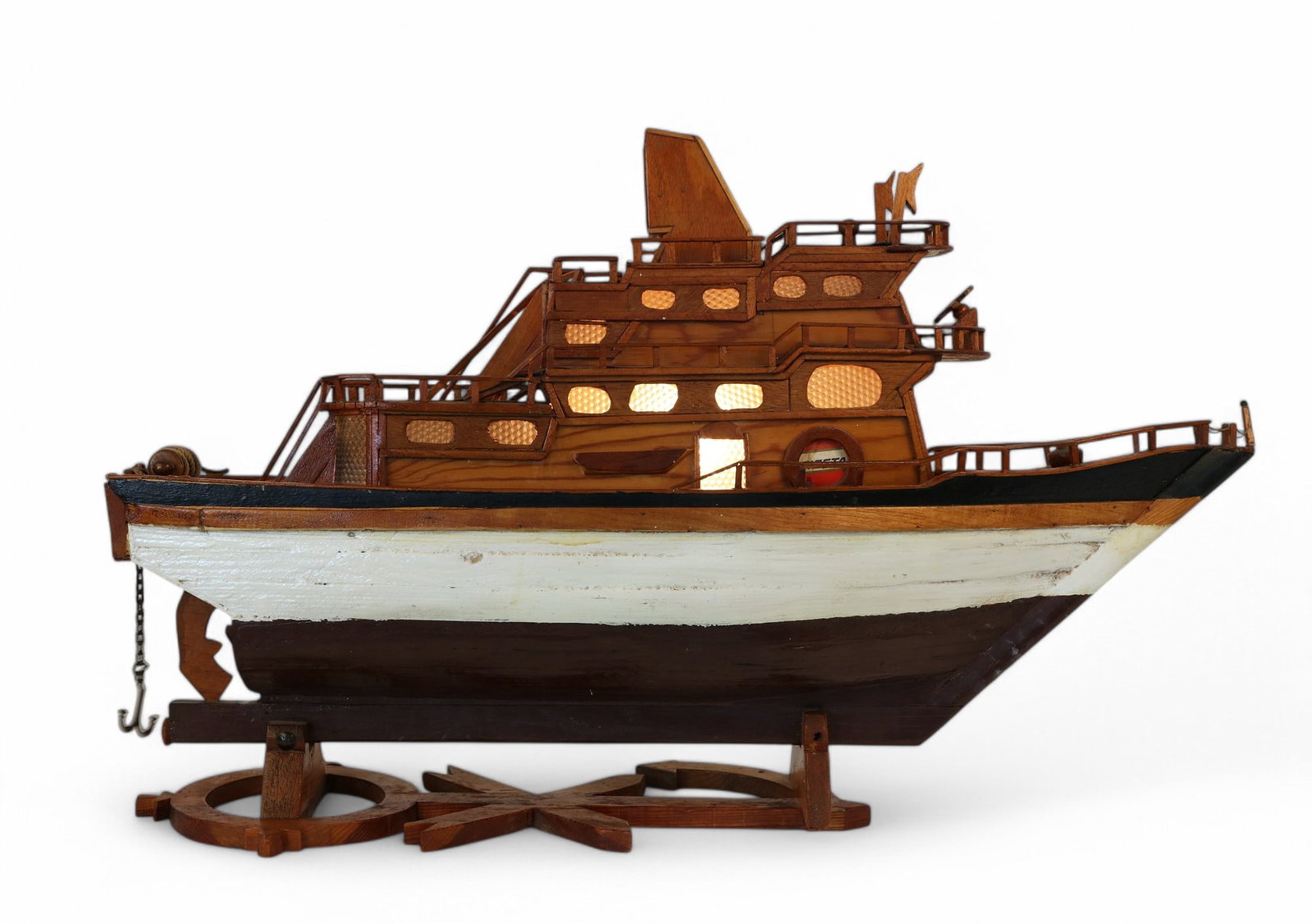 A model of a fishing boat pond yacht: Fiesta: A polychrome decorated wood model of a fishing boat pond yacht: Fiesta 20th century Now wired for electricity. height 28in (70cm); length 42in (105cm); width 11in (27.5cm) Provenance: Property from a 