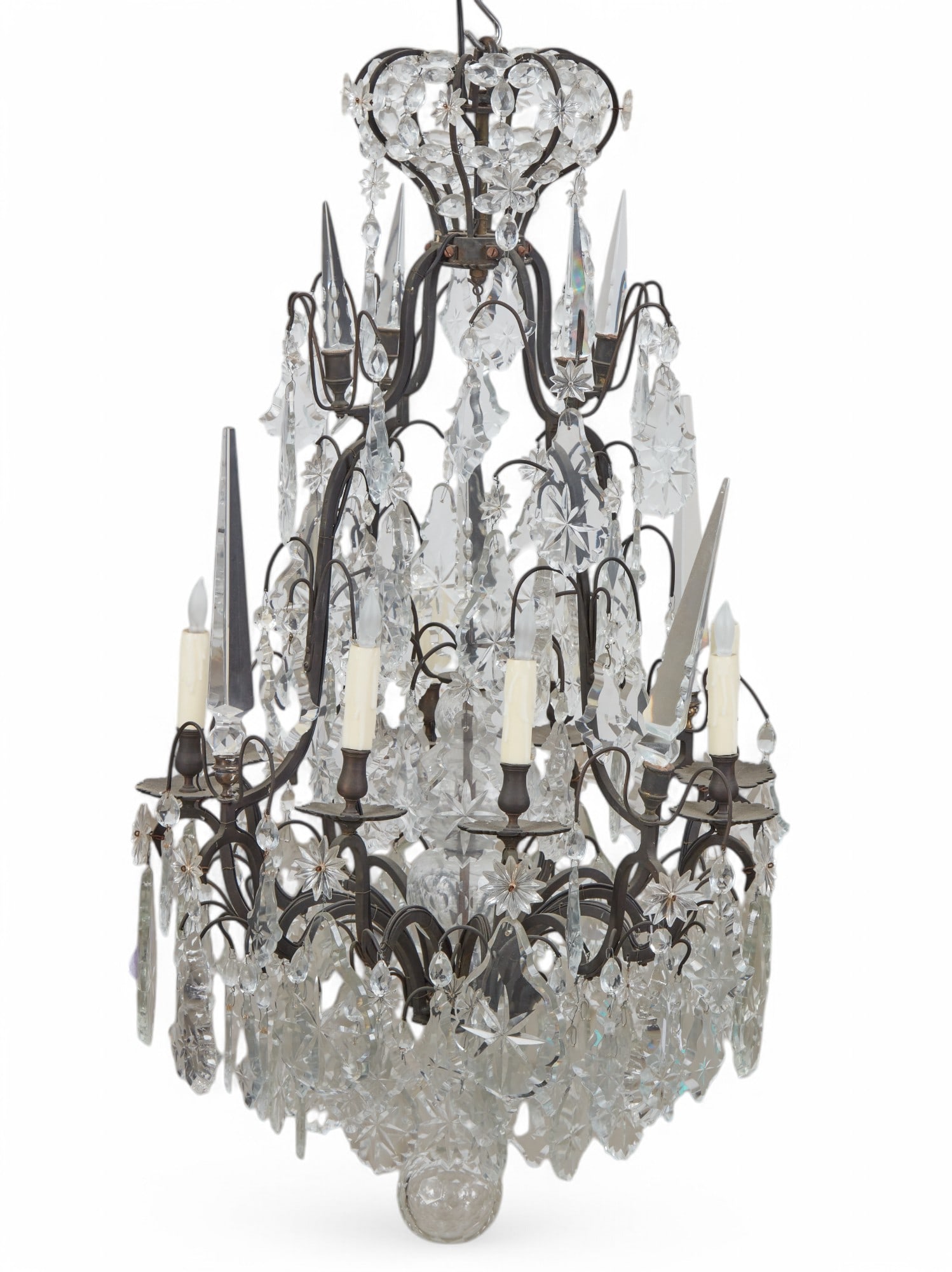 A Louis XV style chandelier: A Louis XV style patinated metal and cut glass eight light chandelier20th centuryheight 44in (112cm); diameter 24in (61cm)