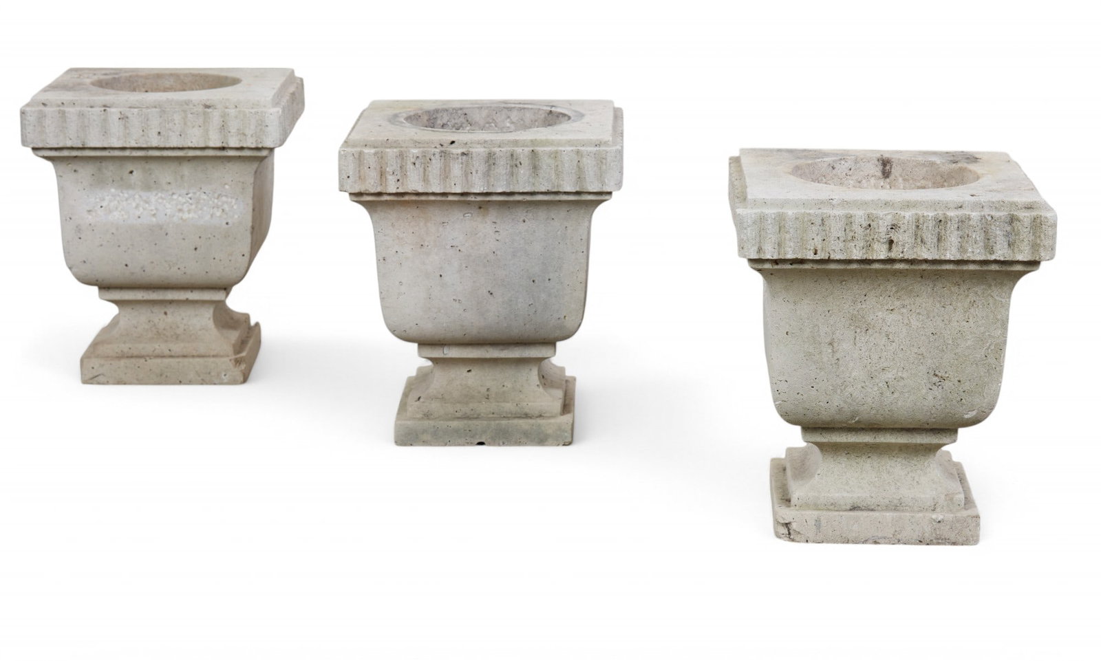 Three Neoclassical style cast stone jardinieres: Three Neoclassical style cast stone jardinieres 20th century height 14in (36cm); width 11 1/2in (29cm) square