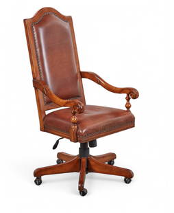 An oak and leather upholstered swivel desk chair: A stained oak and red leather upholstered swivel desk chairmodernOn casters.height 47in (117.5cm); width 23 1/4in (58cm); depth of seat 18in (45cm)