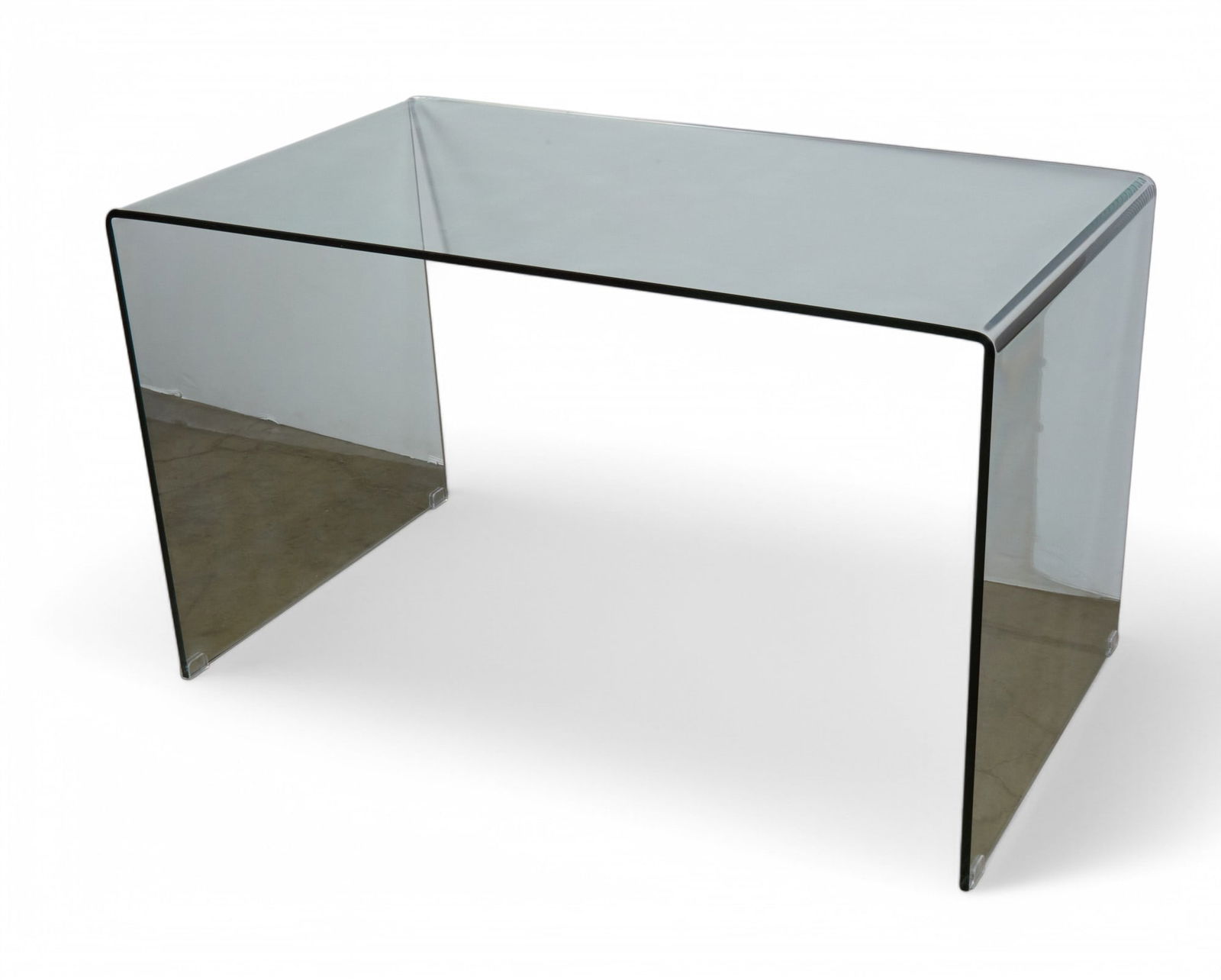 A contemporary clear glass console table: A contemporary clear glass console tableheight 29 1/4in (73cm); width 49 1/2in (124cm); depth 27 1/2in (69cm)