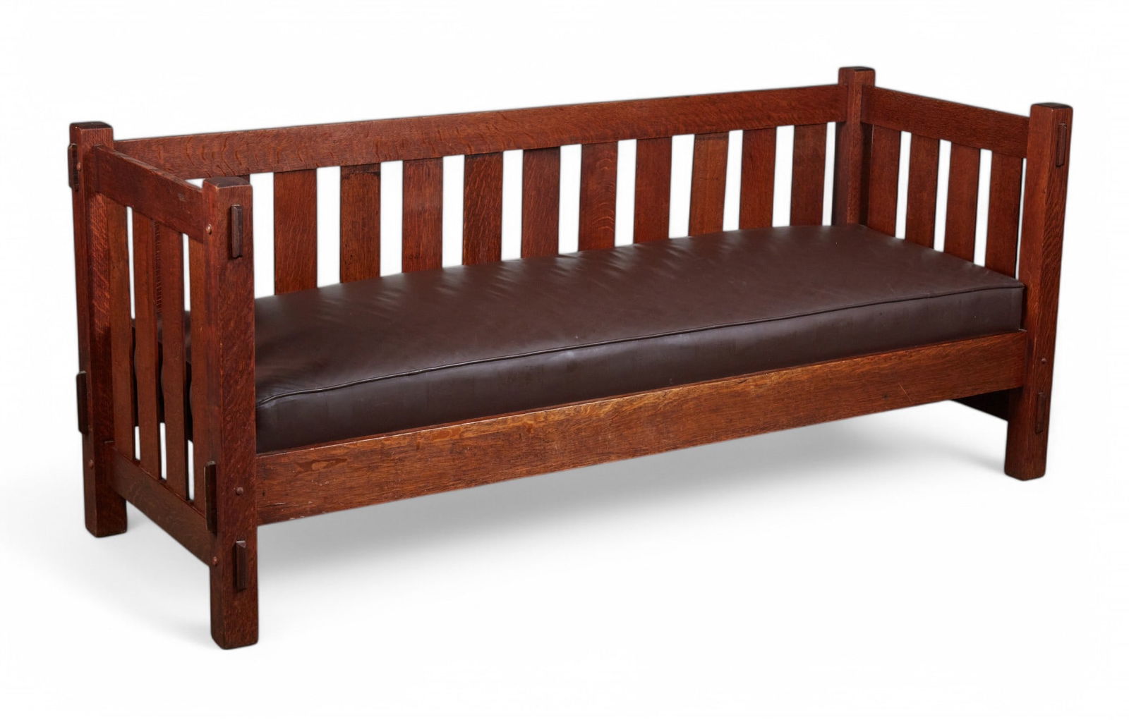An American Mission oak sofa, 20th century: An American Mission oak sofa20th centuryheight 33in (82.5cm); width 79in (197.5cm); depth of seat 26in (65cm)