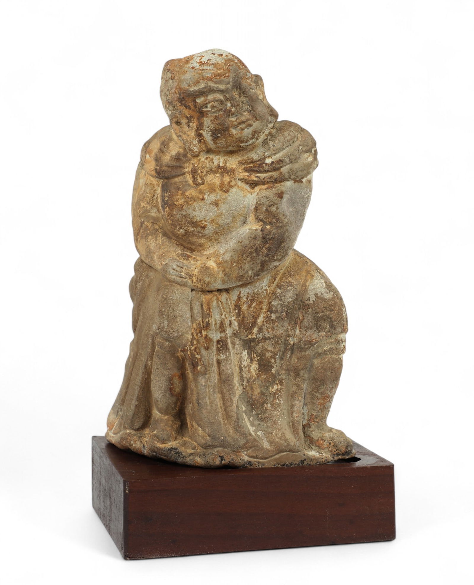 An Asian carved stone kneeling figure (1 of 3)