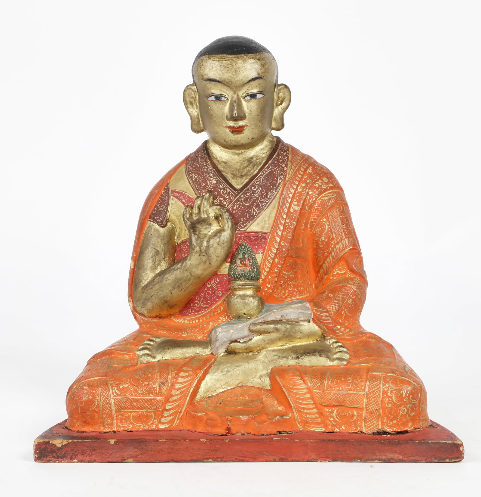 An Asian clay and gilt figure of a seated Lama (1 of 4)