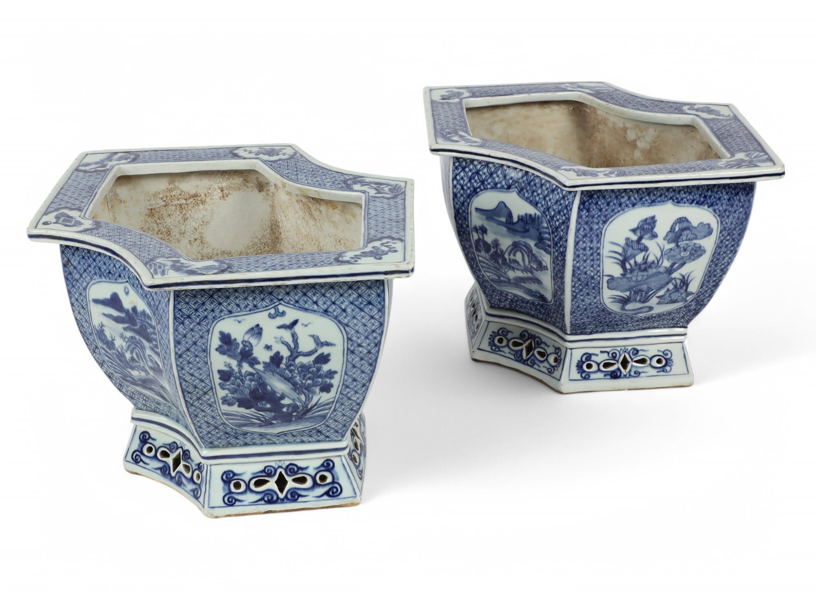 A pair of Chinese blue and white jardinieres: A pair of Chinese blue and white porcelain jardinieres height 9 3/4in (25cm); width 16 3/4in (42.5cm); depth 11 3/4in (30cm)