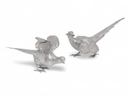 A pair of English sterling silver models of pheasants, Goldsmiths & Silversmiths Co., Ltd., London: A pair of English sterling silver models of pheasants Goldsmiths & Silversmiths Co., Ltd., London 1938 largest height 6 3/4in (17cm); length 12 1/2in (32cm); width 8 1/4in (21cm); weight