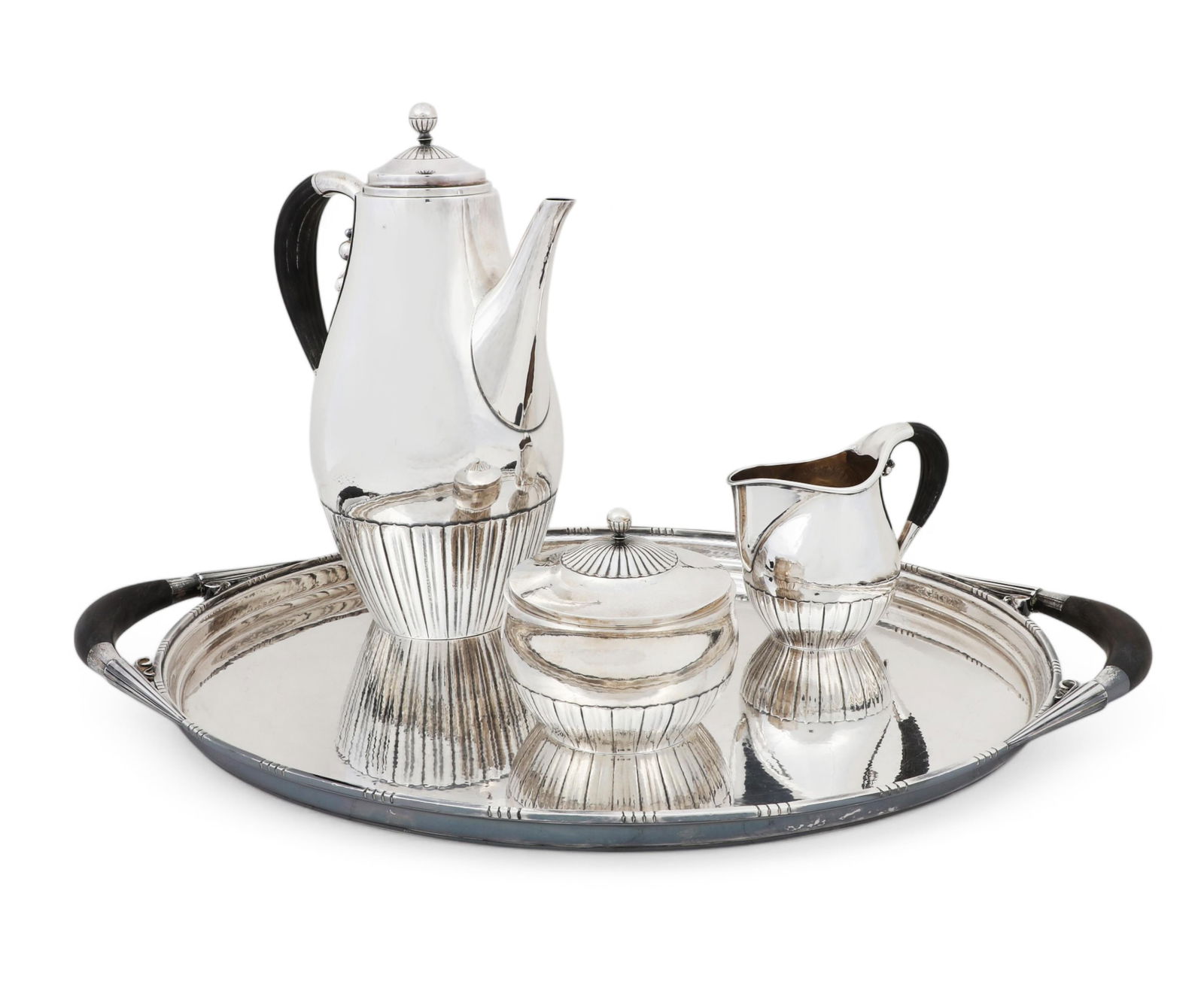 A Danish sterling silver Cosmos coffee service, designed by Johan Rohde for Georg Jensen: A Danish sterling silver four piece Cosmos coffee servicedesigned by Johan Rohde for Georg Jensen Silversmithy, Copenhagenmid 20th centuryModel 45, comprising a coffee pot, a covered sugar bowl, a cre