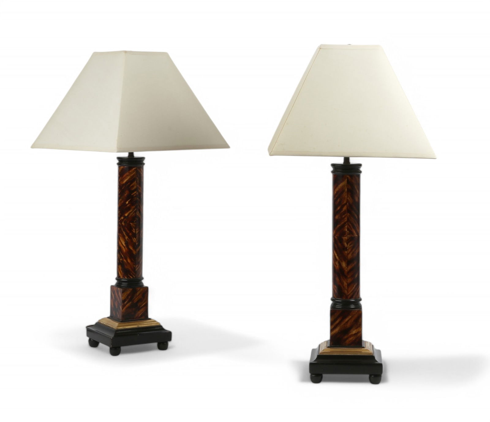 A pair of Charles Pollock faux tortoiseshell and parcel gilt table lamps, Modern: A pair of Charles Pollock faux tortoiseshell and parcel gilt table lampsModernheight excluding fitments 22in (55cm); width 7 1/2in (19cm) square Provenance:From a Private Collection Hancock Park, CA.