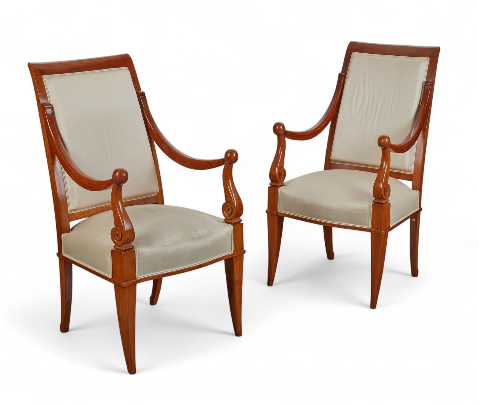 A pair of Art Deco style mahogany armchairs, in the manner of Andre Arbus, 20th century: A pair of Art Deco style mahogany armchairsin the manner of Andre Arbus20th centuryheight 41 1/2in (105cm); width 22in (56cm); depth of seat 17 1/2in (44cm) Provenance:Property from a San Diego, CA C